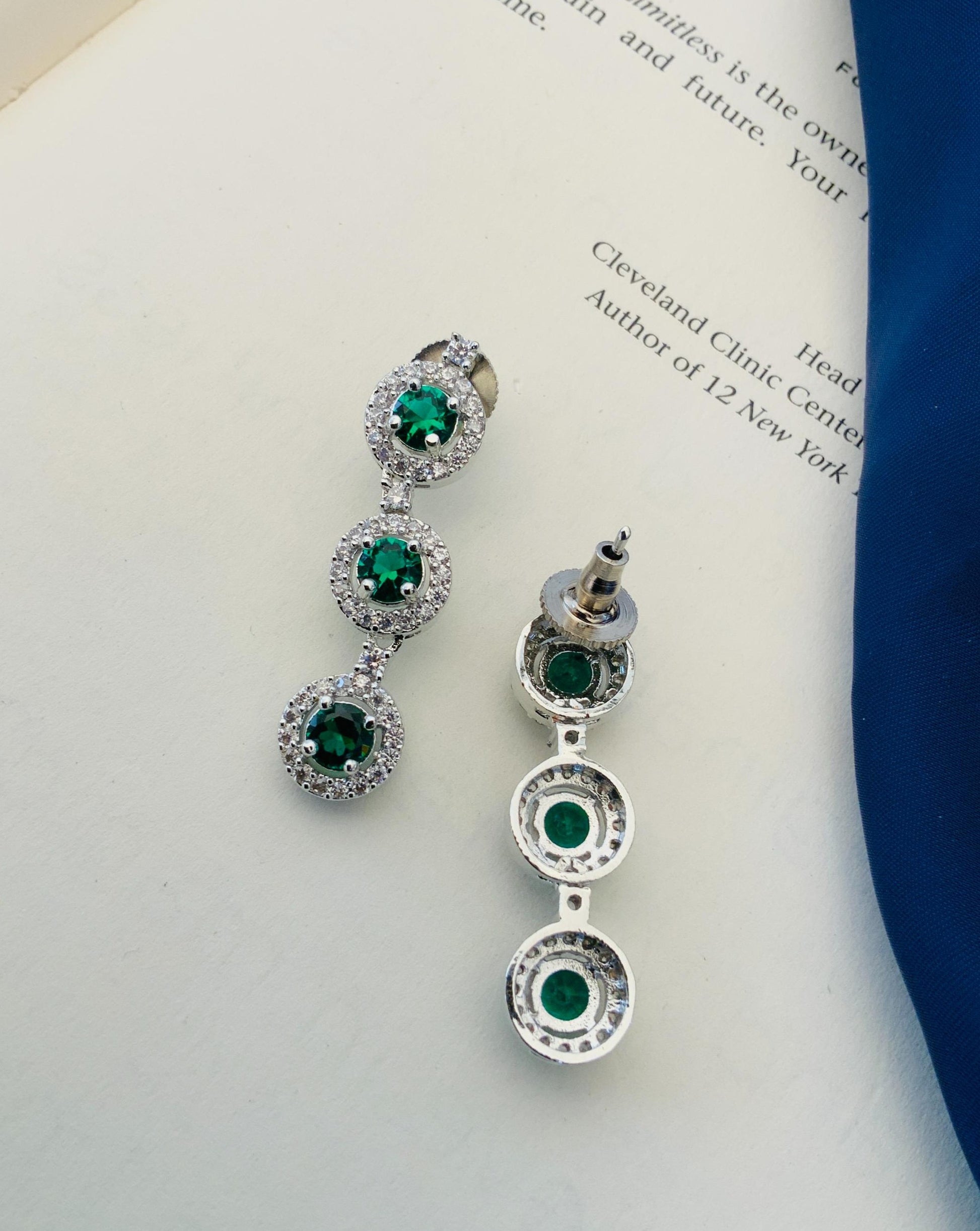 Abdesigns Silver Plated American Diamond Necklace Set displayed as matching green stone triple drop earrings on white background