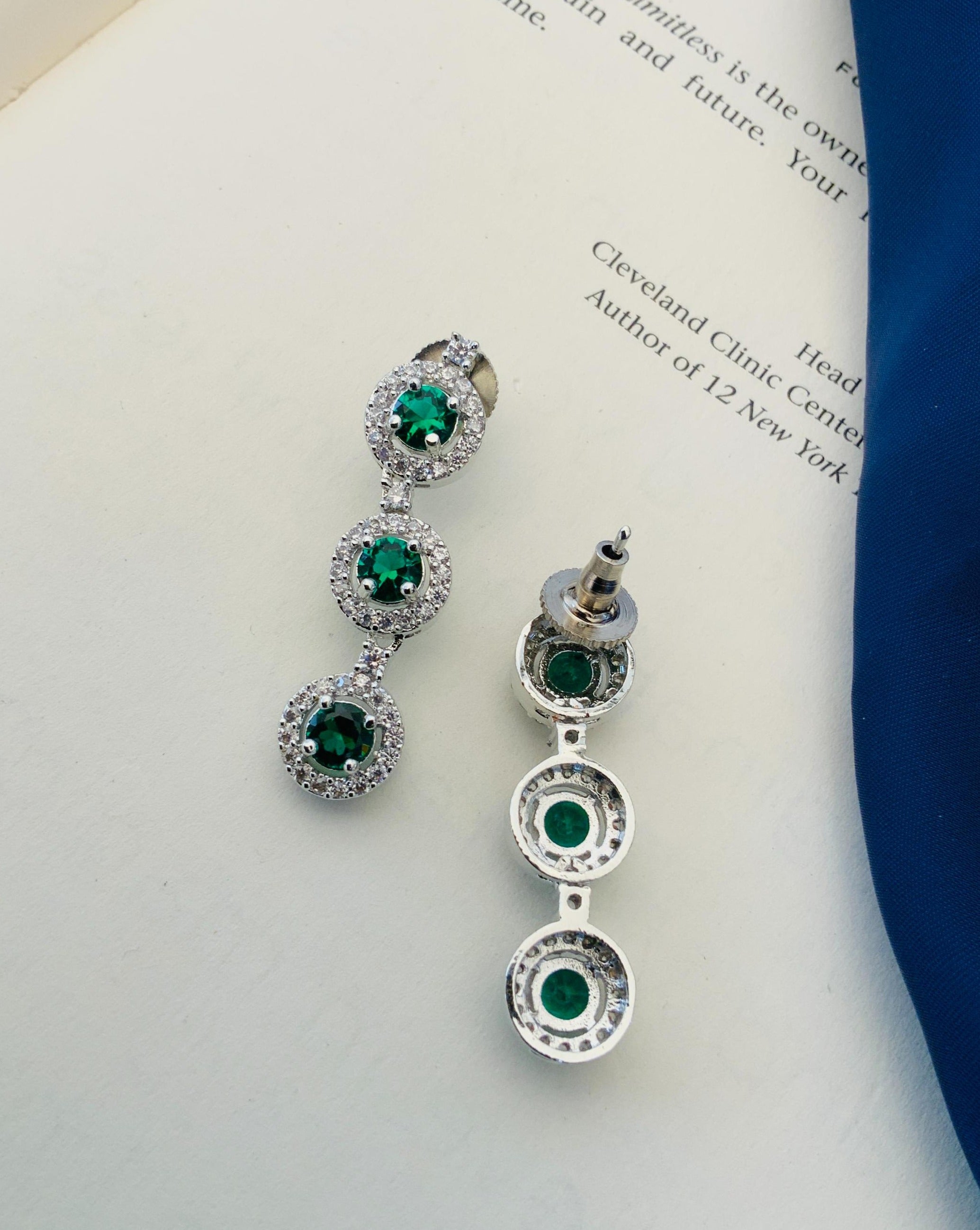 Abdesigns Silver Plated American Diamond Necklace Set displayed as matching green stone triple drop earrings on white background