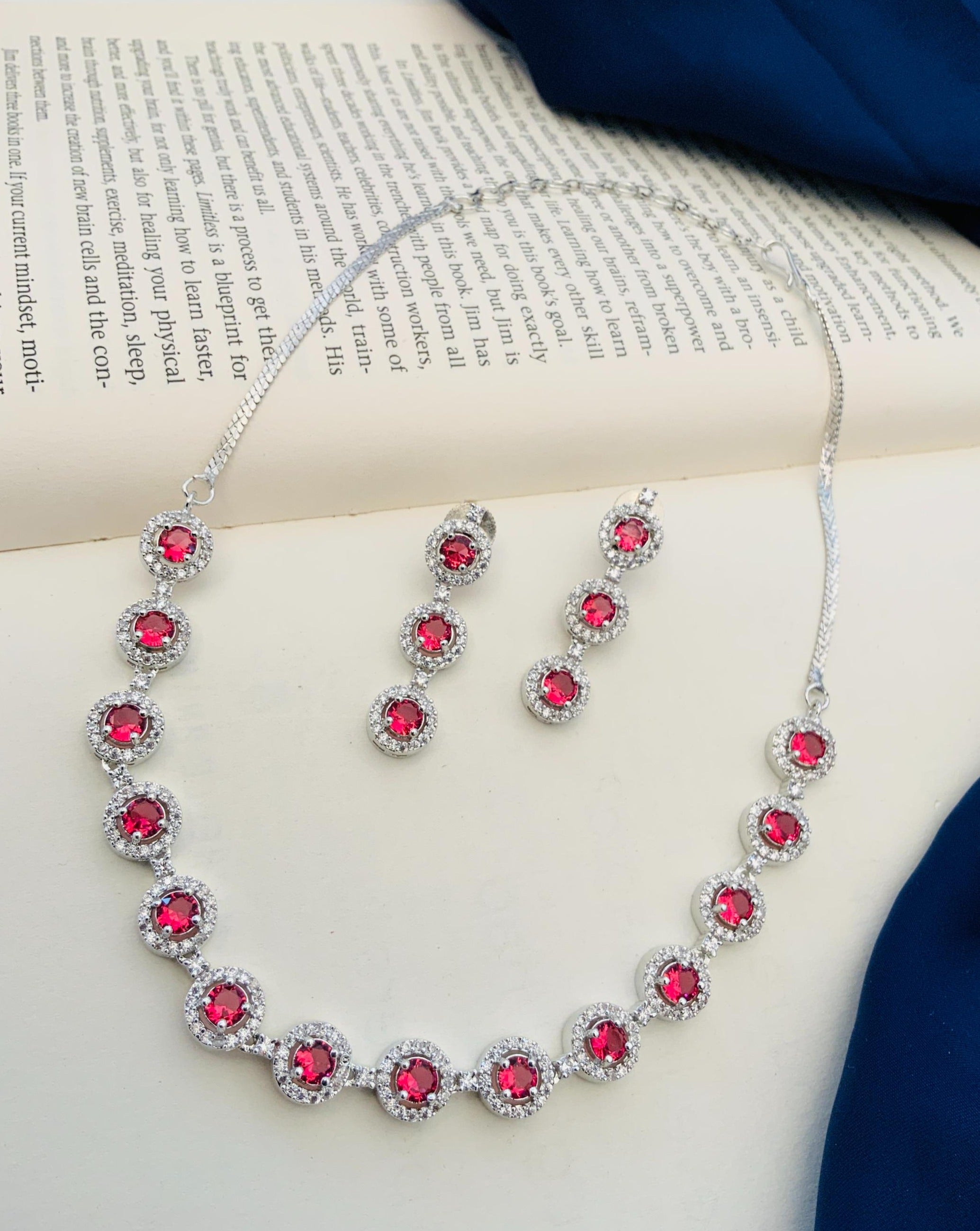 Abdesigns Silver Plated American Diamond Necklace Set with ruby red stones and matching drop earrings