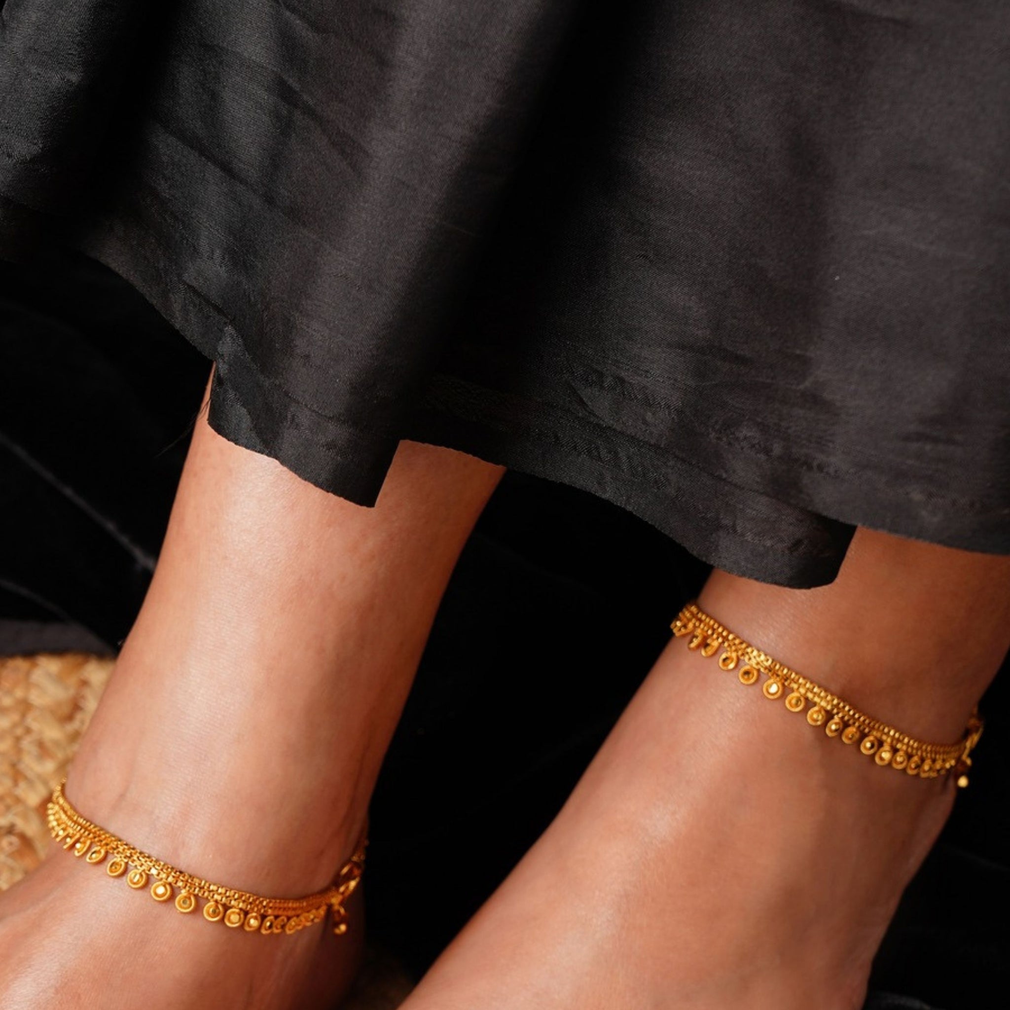 Antique Round Pattern Gold Plated Anklets worn on both feet with intricate detailed design