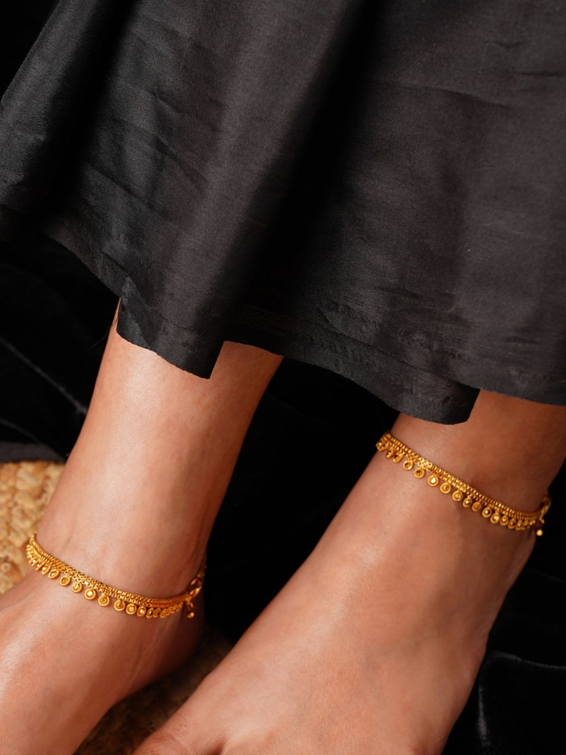 Antique Round Pattern Gold Plated Anklets worn on both feet with intricate detailed design