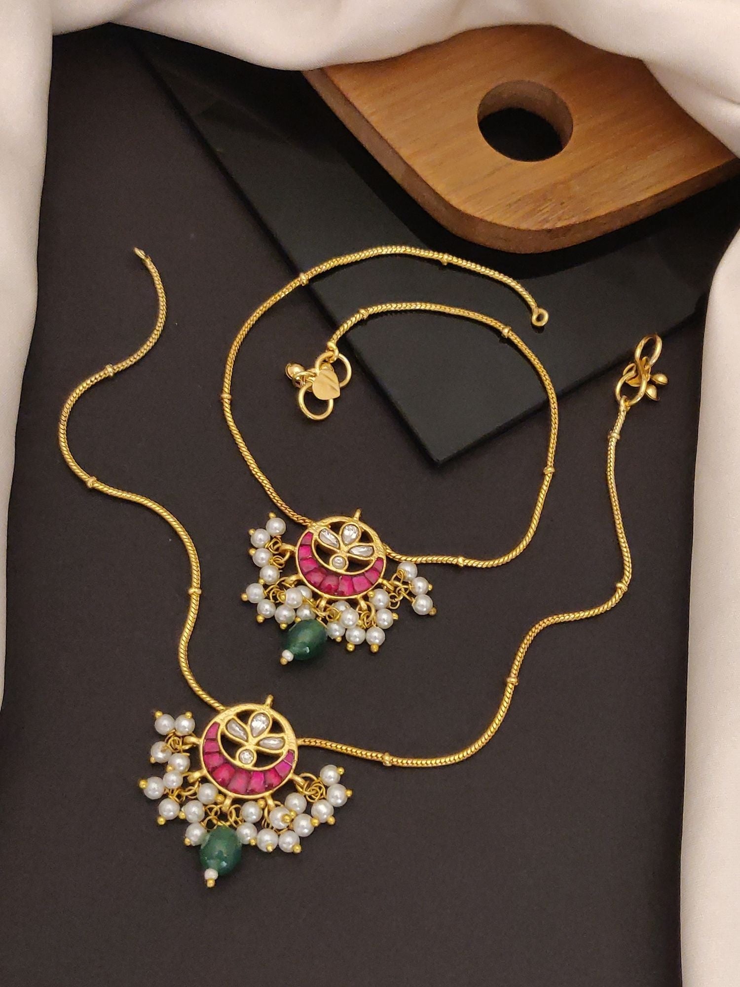 Abdesignsjewellery gold artificial anklets with stones and pearls featuring pink enamel motifs pearl clusters and green bead drops