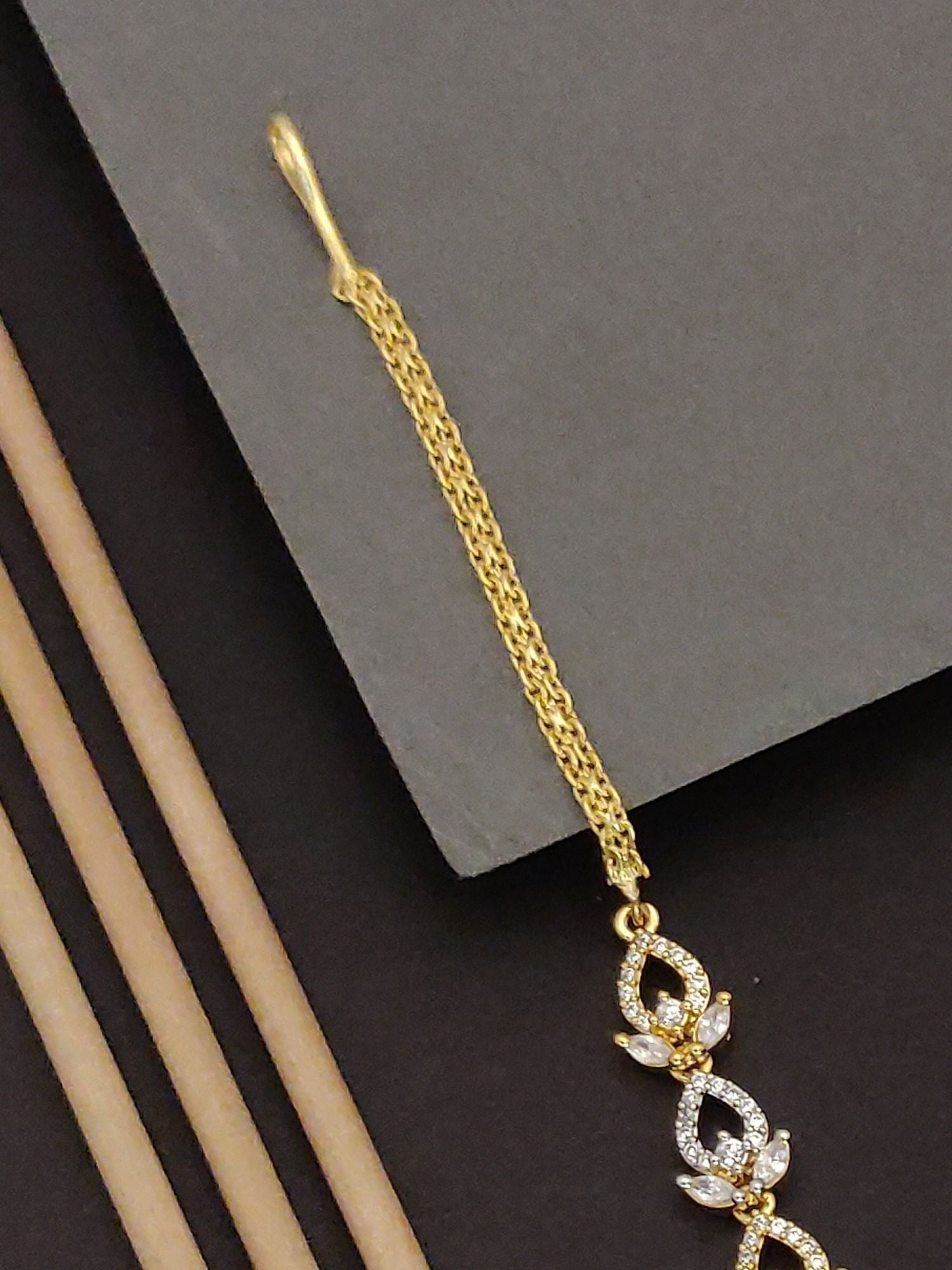 Gold tone artificial bridal maangtikka online with crystal floral drop and long chain by Abdesignsjewellery