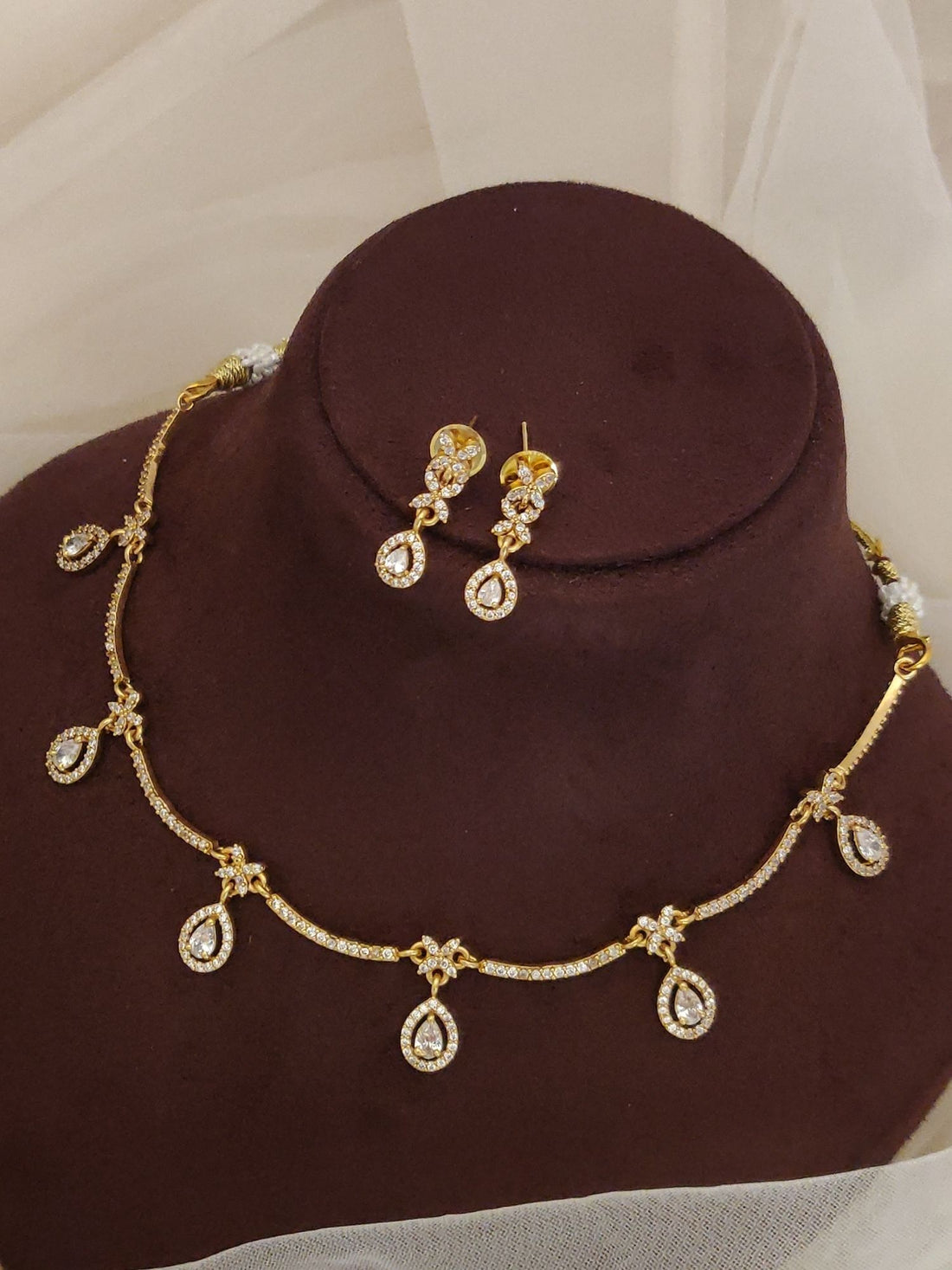 Abdesignsjewellery gold artificial diamond necklace with earrings featuring teardrop pendant drops and floral links