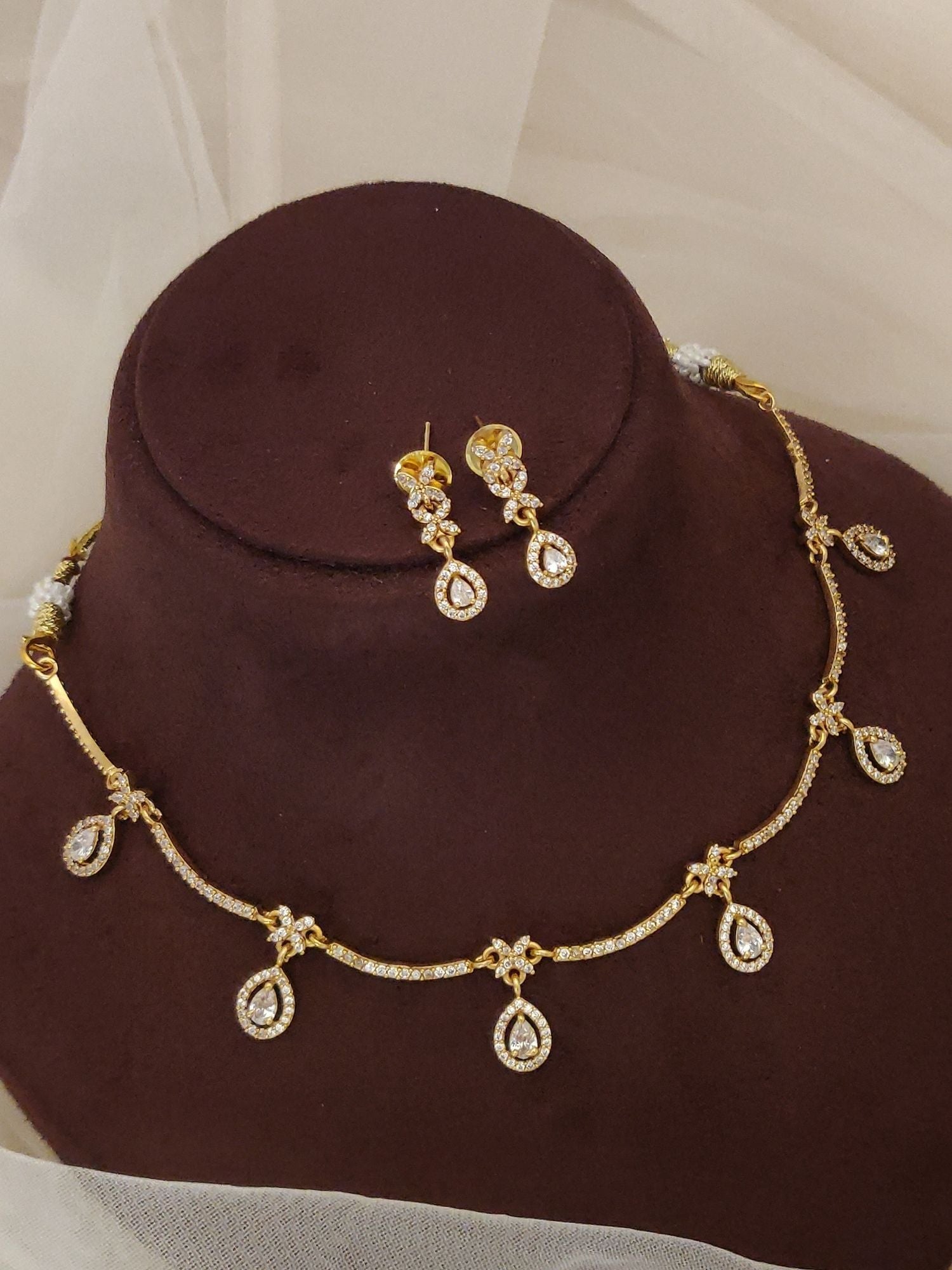 Abdesignsjewellery gold artificial diamond necklace with earrings featuring teardrop pendant drops and floral links