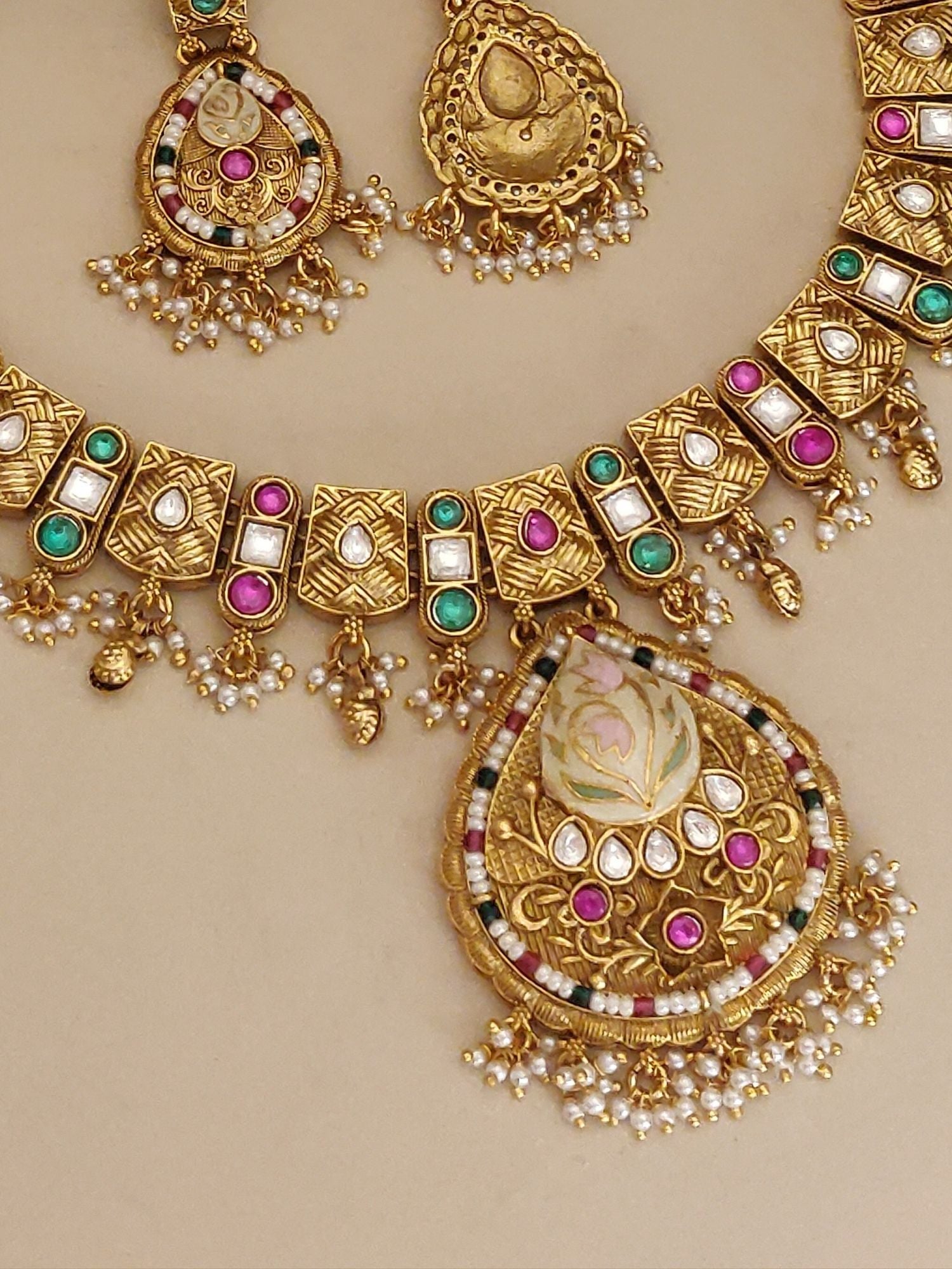 Abdesignsjewellery artificial gold maangtikka necklace earrings set with kundan stones pink green accents and pearl drops