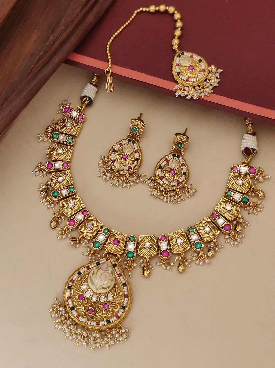 Abdesignsjewellery artificial gold maangtikka necklace earrings set with pink and green stones and pearl detailing