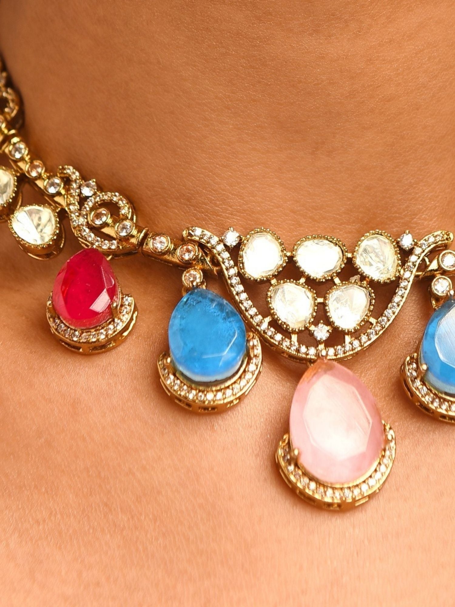 Abdesignsjewellery artificial gold plated multicolour choker set close up showing teardrop red blue pink stones and white crystals