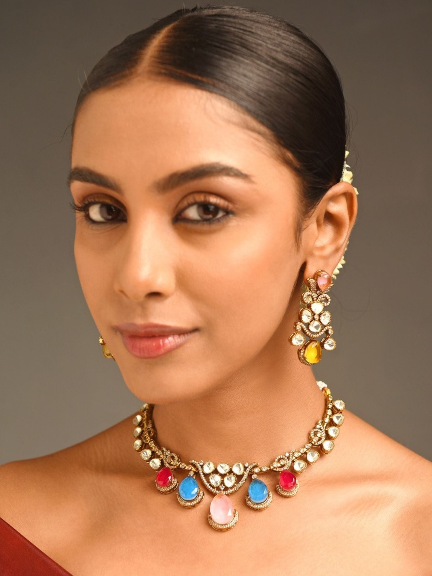 Abdesignsjewellery model wearing artificial gold plated multicolour choker set with kundan and teardrop stones