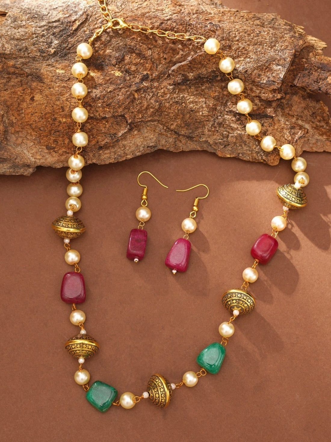 artificial multicolor bead necklace for women on model featuring green red and gold beads with pearl spacers