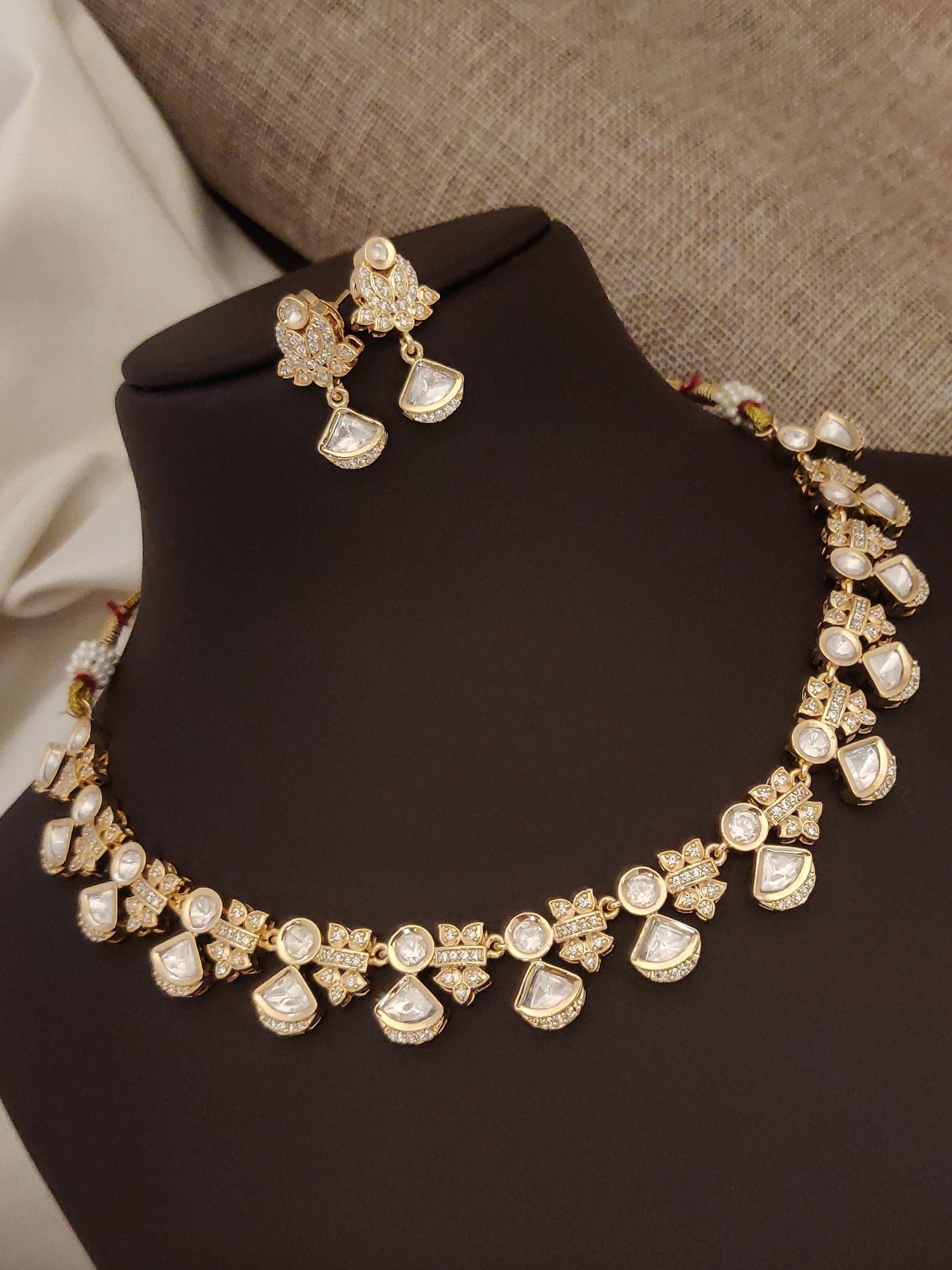 Elegant artificial polki necklace with earrings in gold and intricate floral design