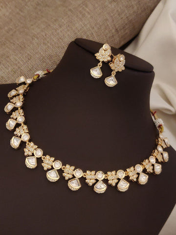 Elegant artificial polki necklace with earrings, featuring intricate gold design and shiny gems