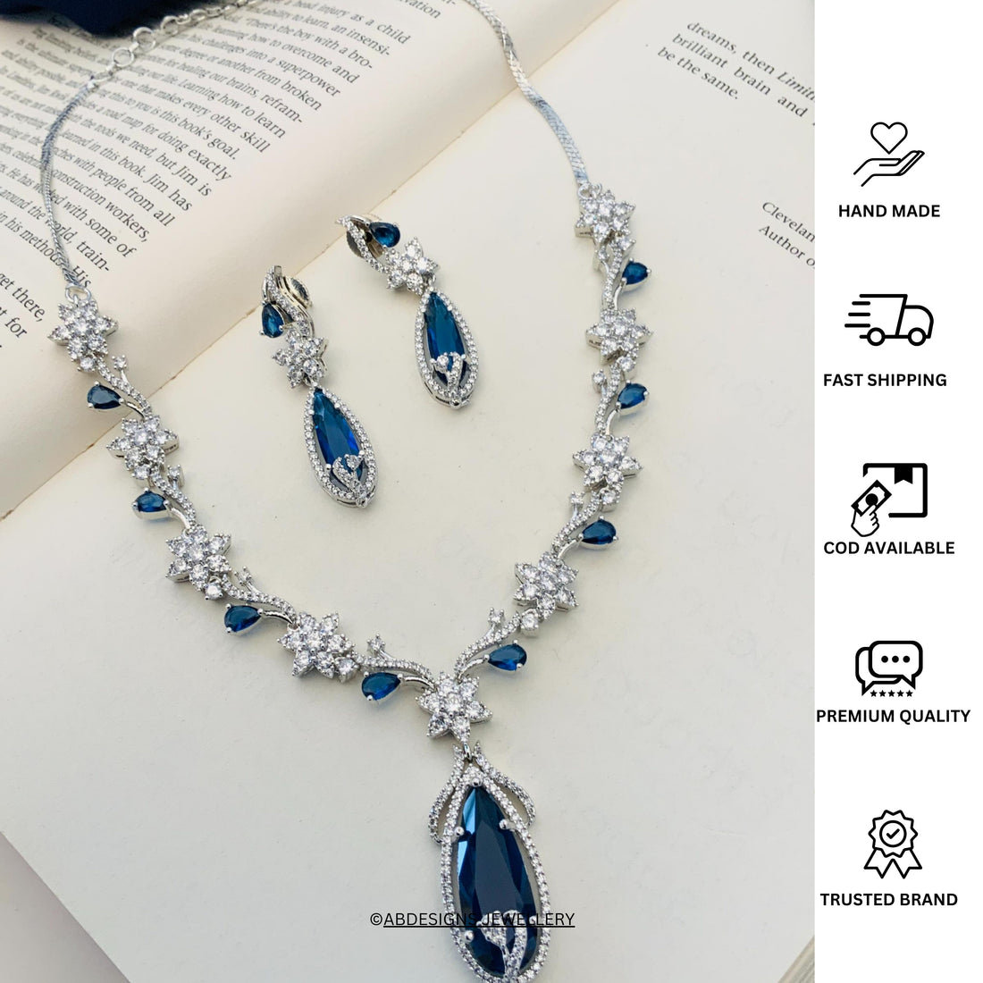 Blue Sapphire Silver Plated American Diamond Necklace Set worn by a woman with matching earrings