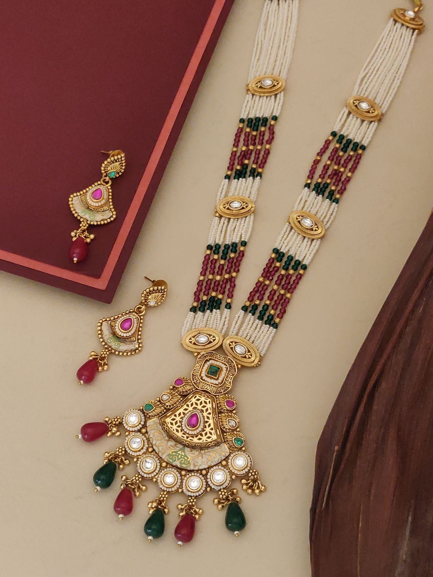 Bridal Long Gold Plated Artificial Stone Beads Necklace Set with ornate gold pendant and matching red green stone beaded earrings