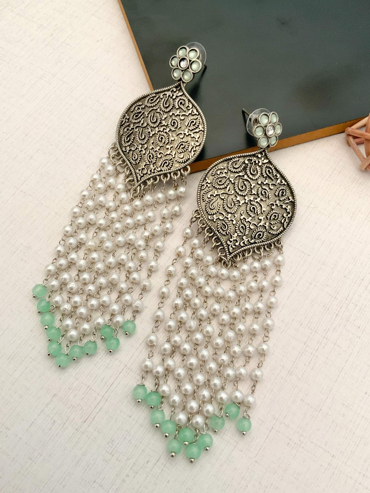 Delicate German Silver Plated Long Earring with intricate floral design and pearl bead strands with green accents
