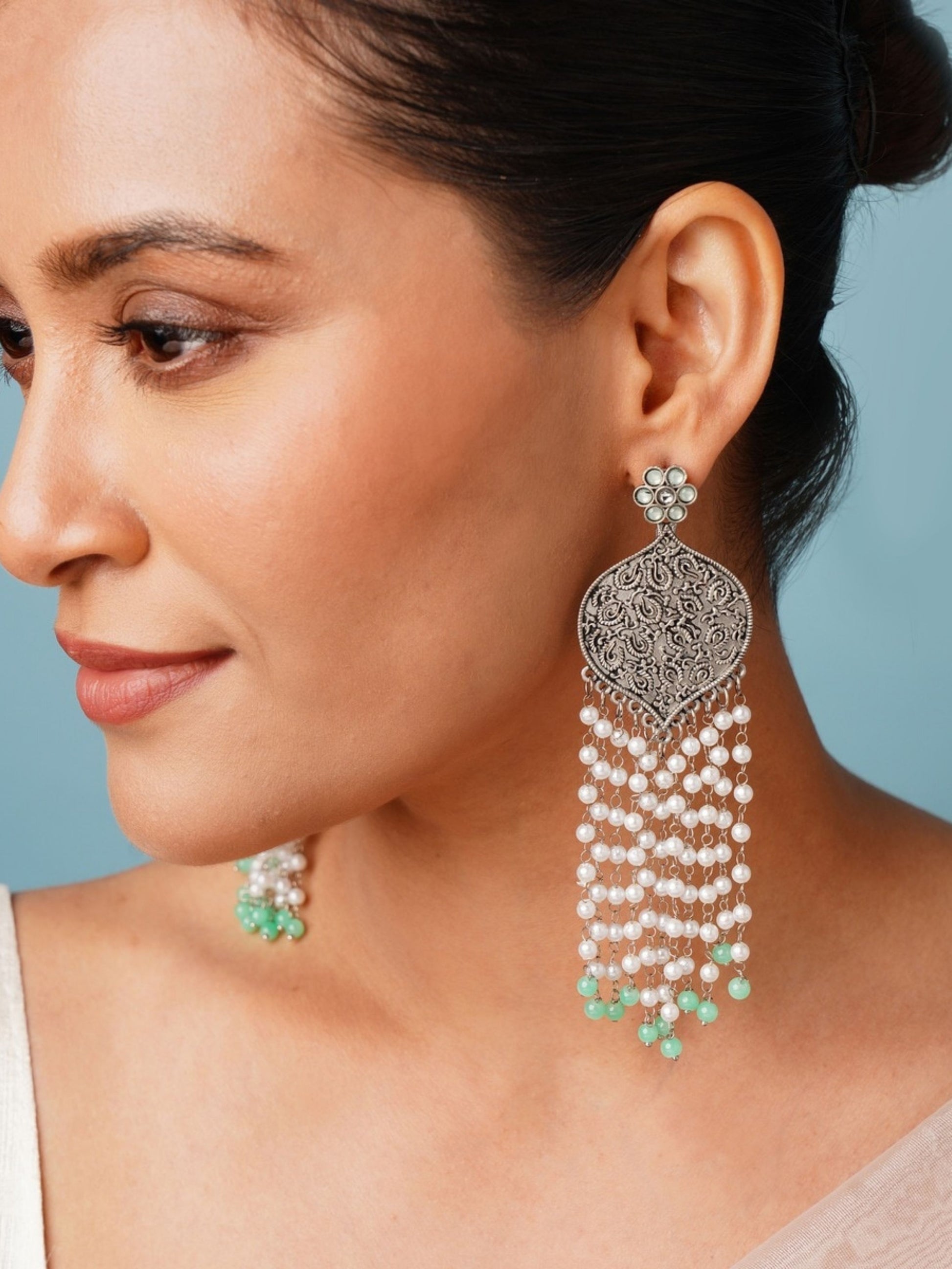 Delicate German Silver Plated Long Earring with intricate design and pearl tassels worn by woman