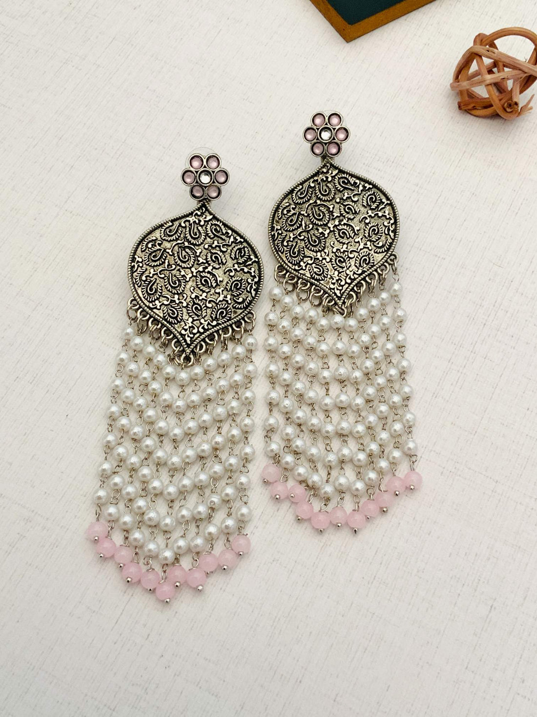 Delicate German Silver Plated Long Earring with intricate design and pearl tassels worn by woman