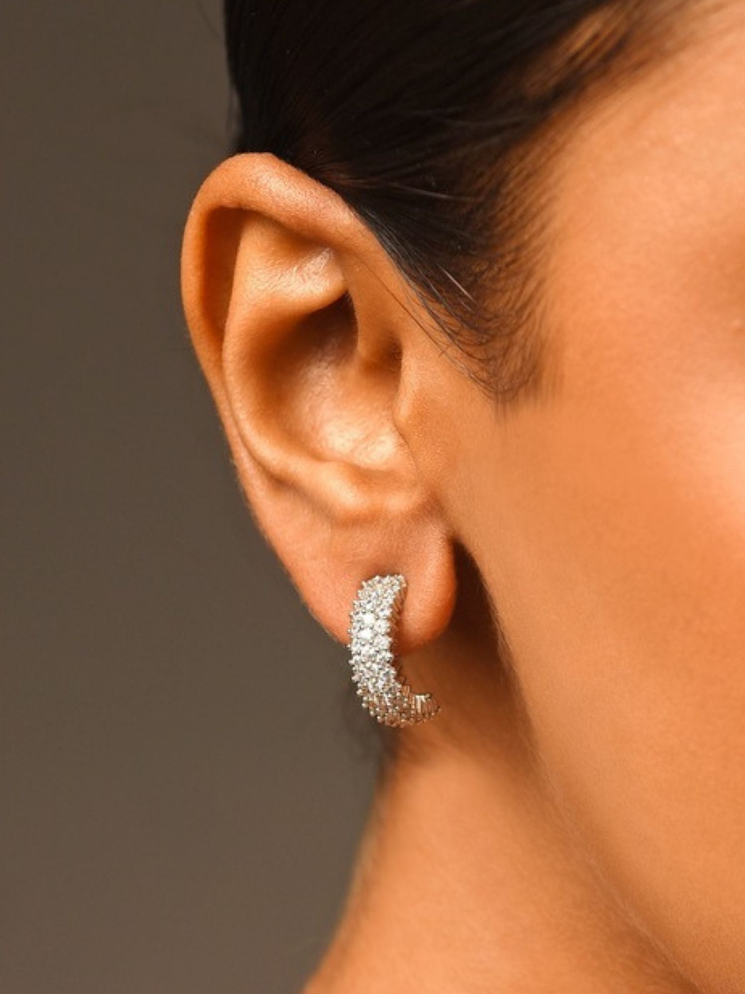 Delicate Silver Plated American Diamond Earring worn on ear showcasing sparkling hoop design by Abdesignsjewellery