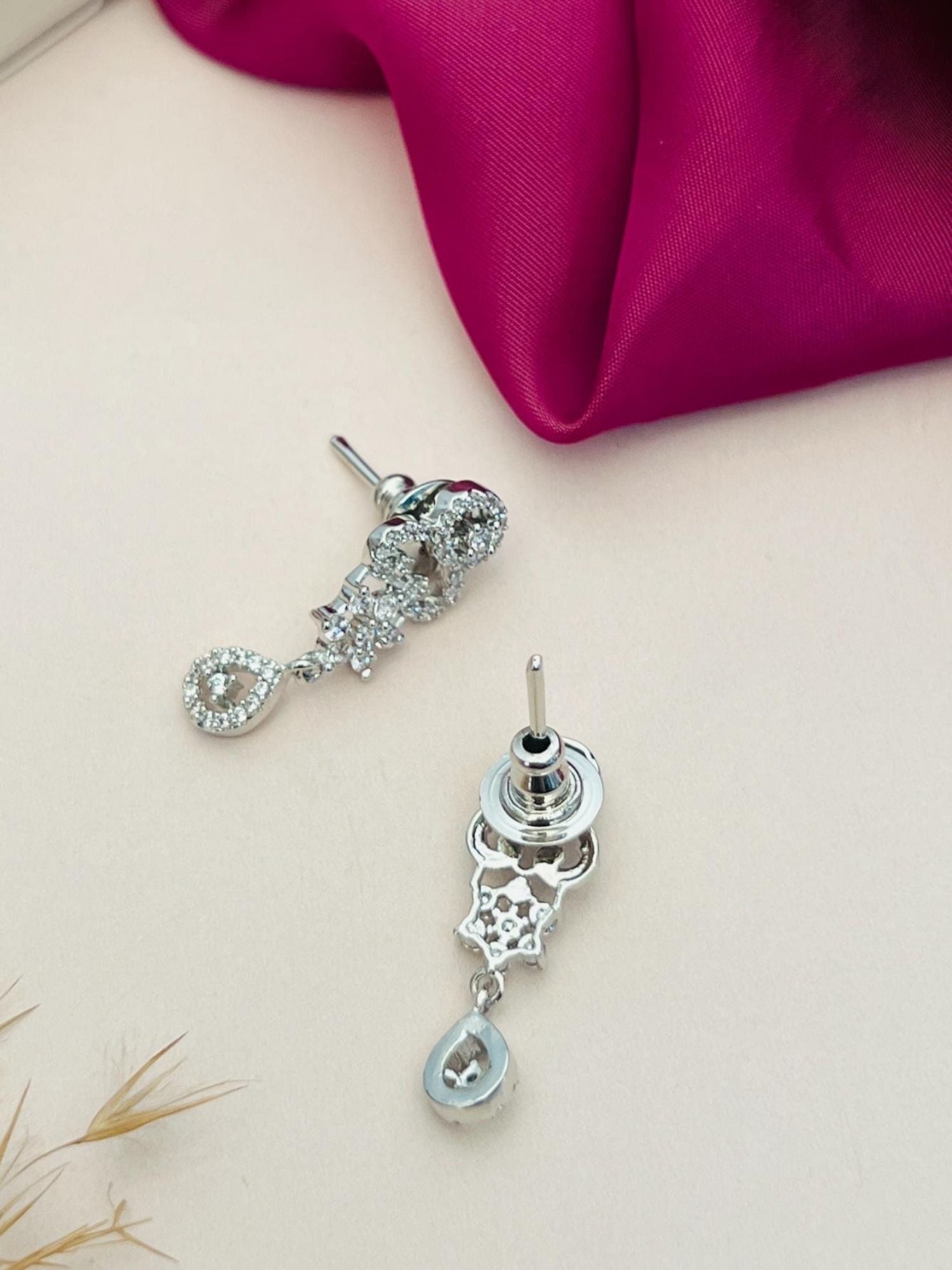Delicate Silver Plated American Diamond Mangalsutra With Earrings showcasing intricate teardrop earrings on cream background