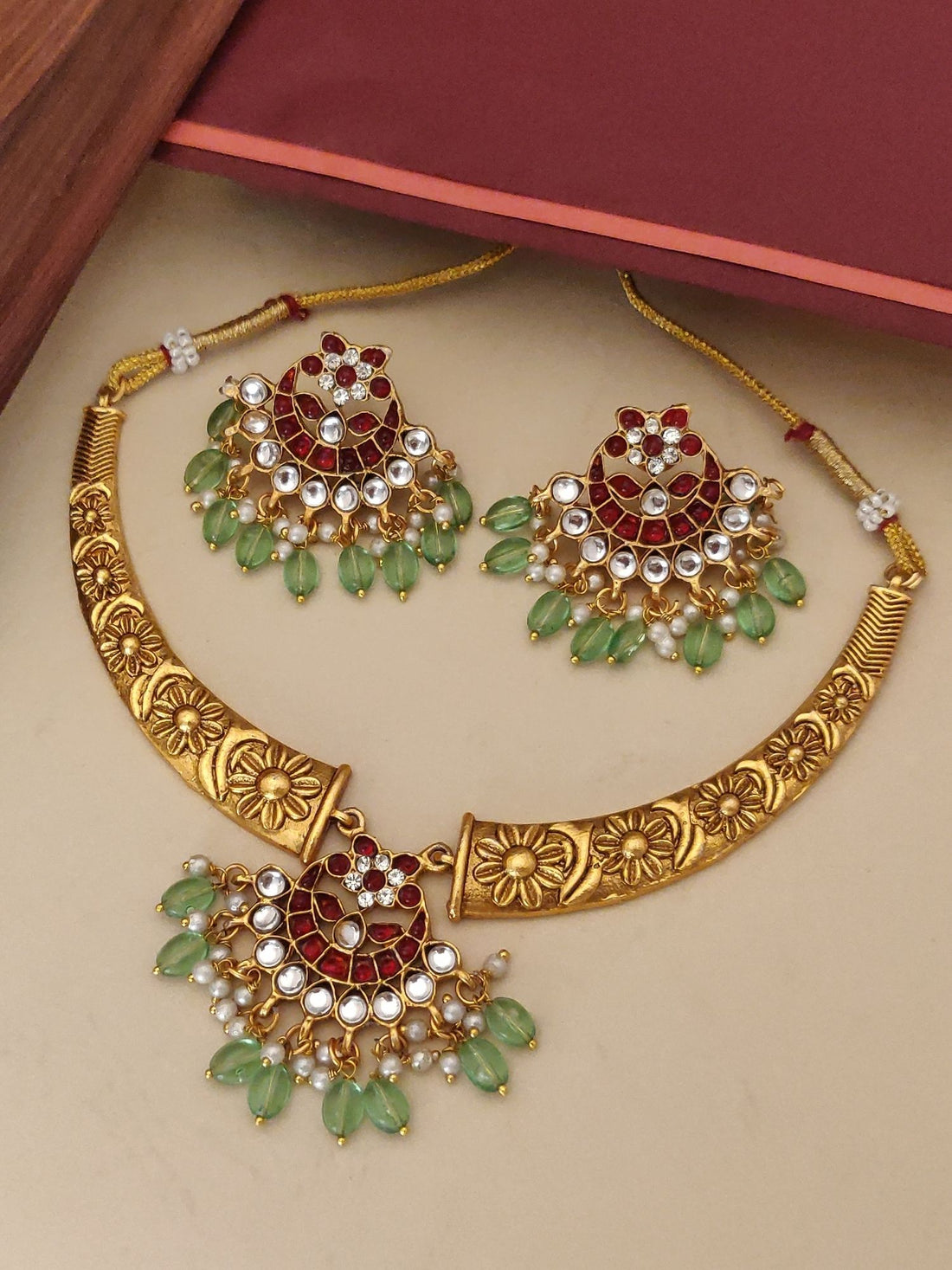 Gold floral Indian necklace set with red stones pearls and green beads designer fashion necklace set for women