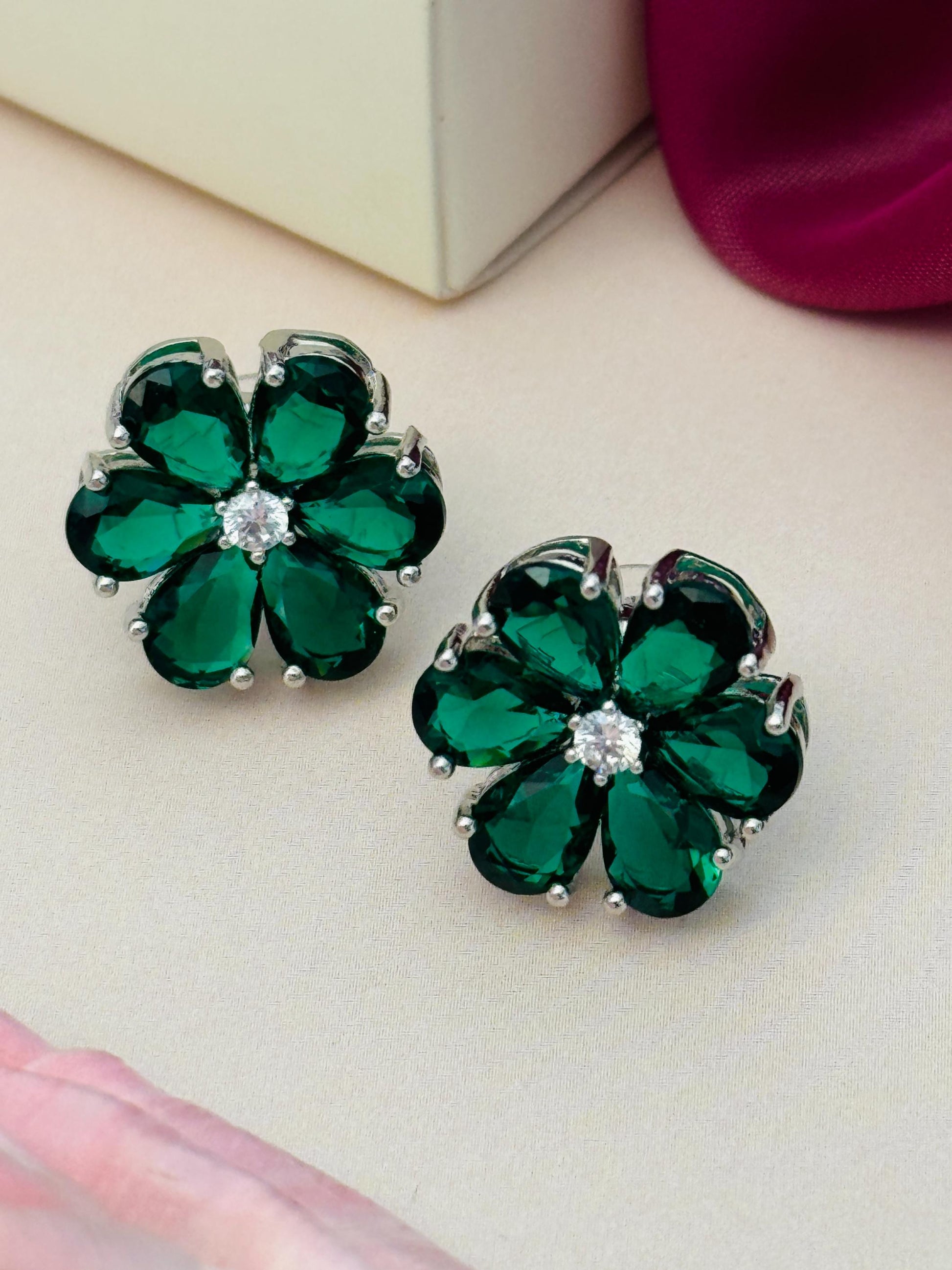 Elegant Green Stone Earrings By Abdesigns Jewellery. Pair of silver flower studs with emerald petals and central crystal