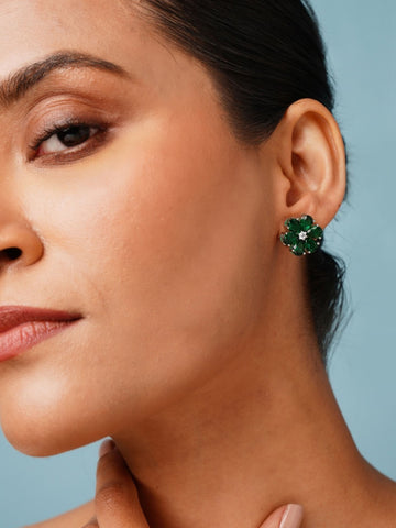 Elegant Green Stone Earrings By Abdesigns Jewellery. Close up on model wearing green floral stone stud earrings