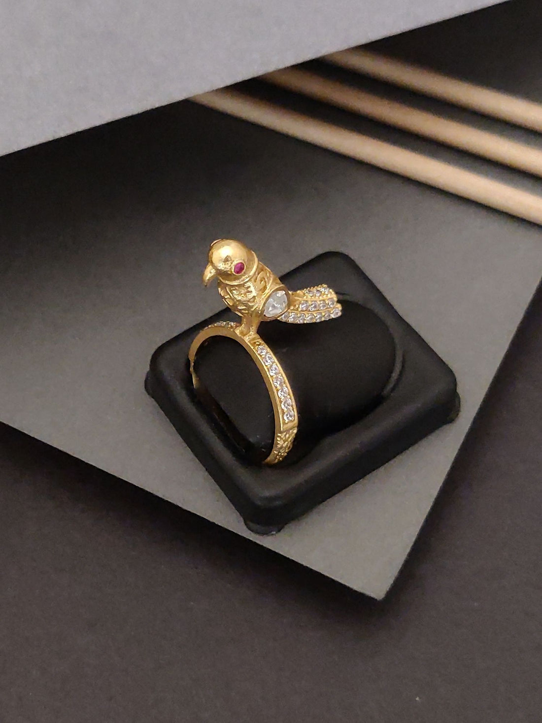 Elegent Gold Plated Sparow Ring featuring a detailed sparrow design with gemstone eyes on a decorative band