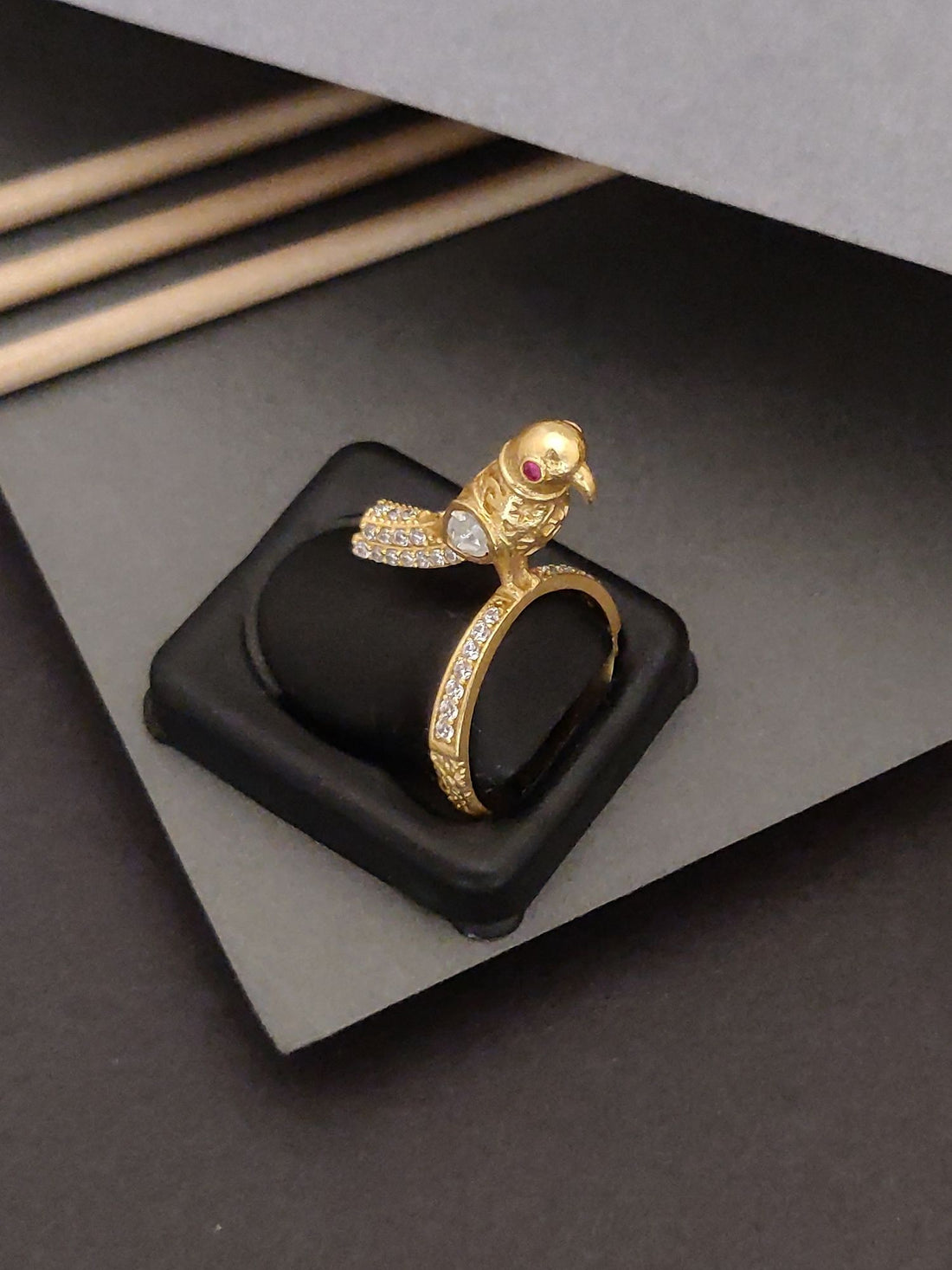 Elegent Gold Plated Sparow Ring featuring a detailed sparrow design with gemstone eyes on a decorative band