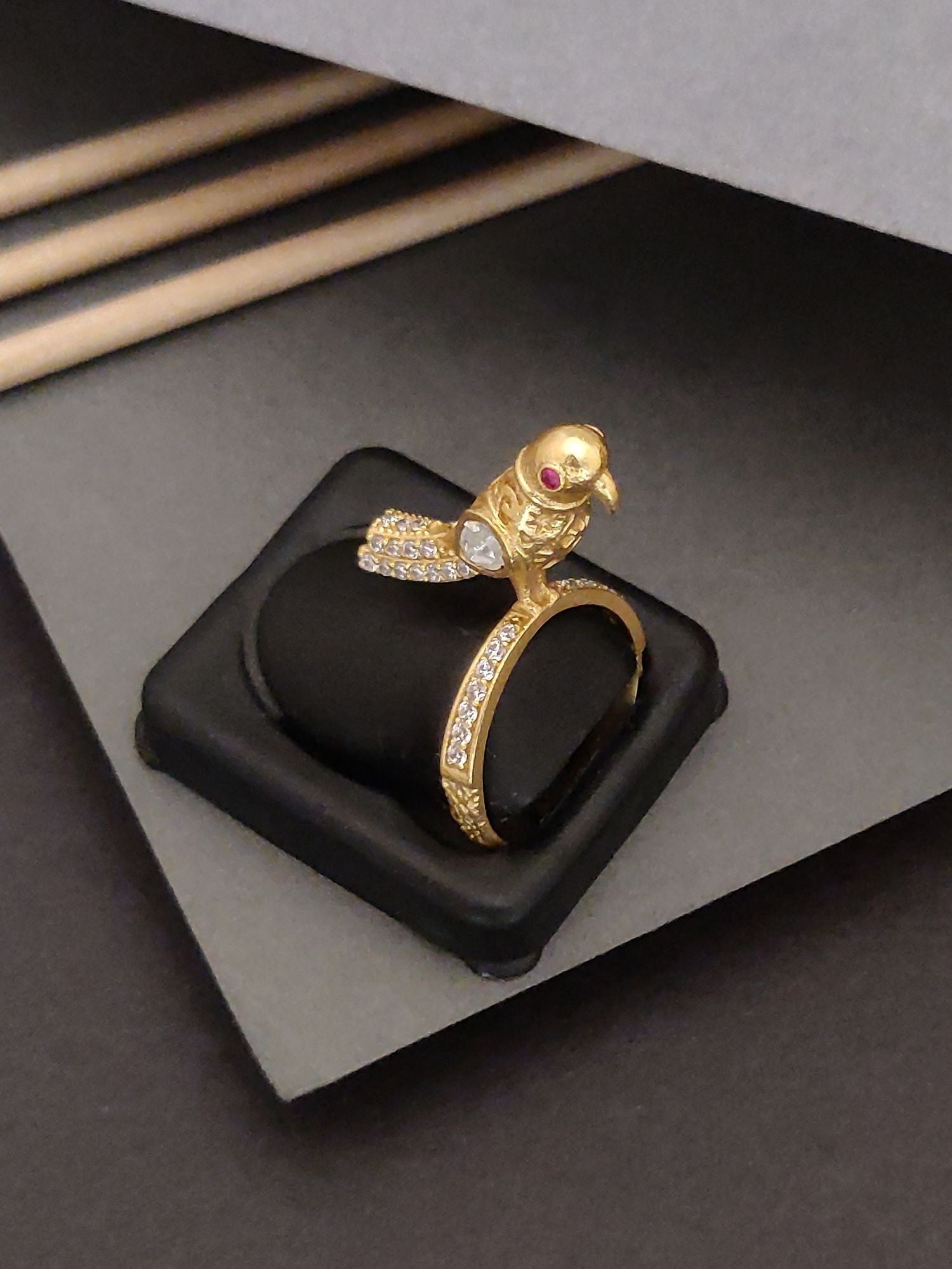 Elegent Gold Plated Sparow Ring by Abdesignsjewellery featuring a detailed bird design with red eyes and sparkling stones
