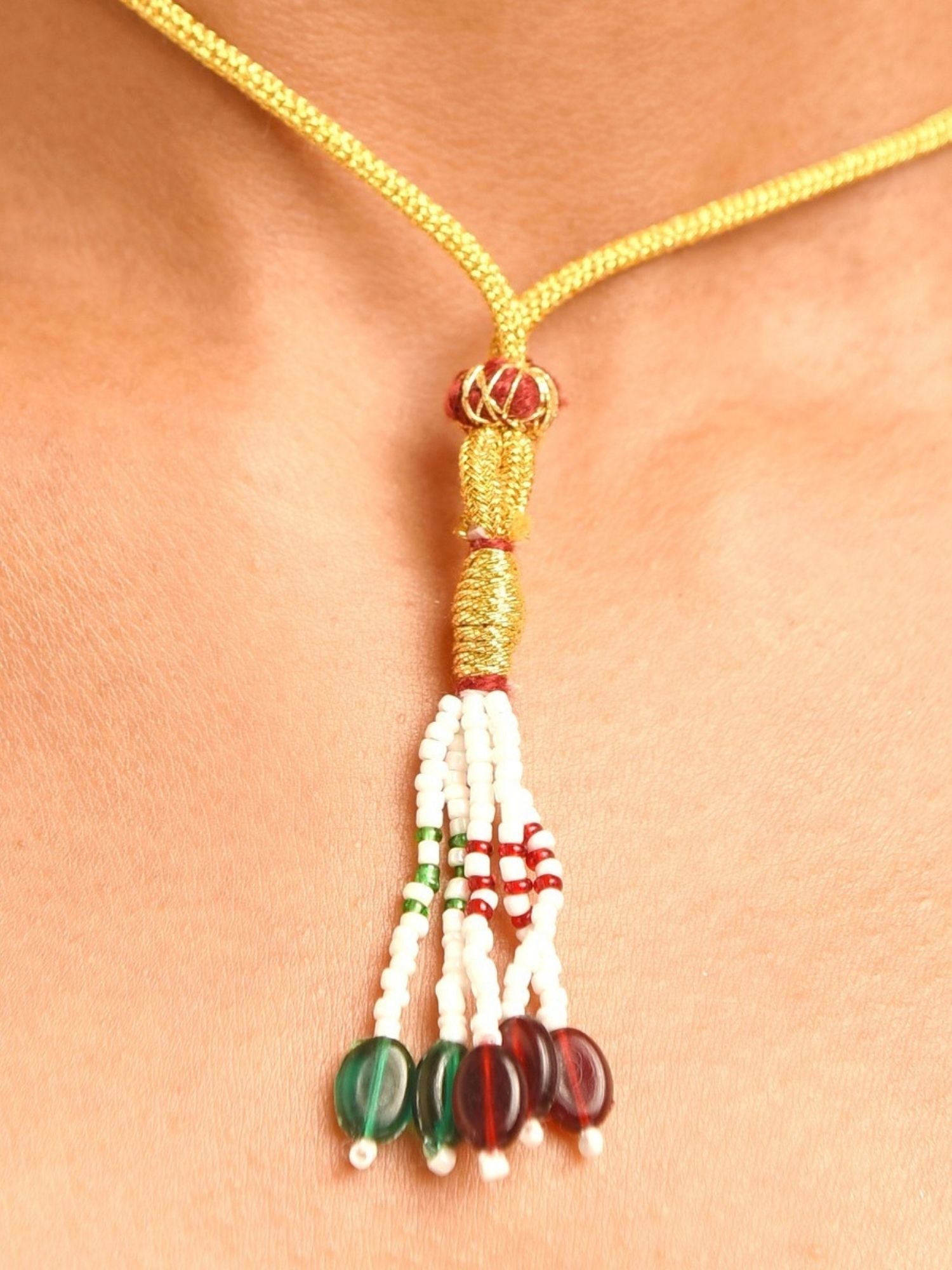 Abdesignsjewellery elephant design polki necklace gold cord with woven bead connector and white green red tassel