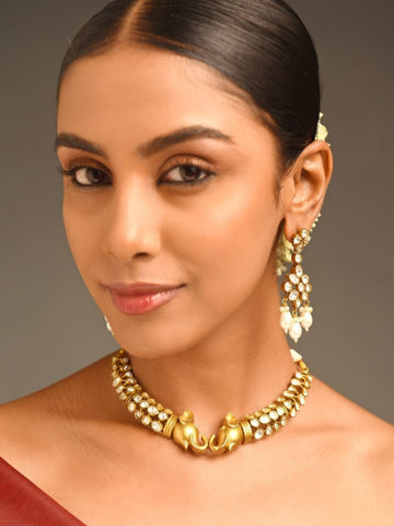 Abdesignsjewellery model wearing gold choker with twin elephant motifs and polki stones elephant design polki necklace