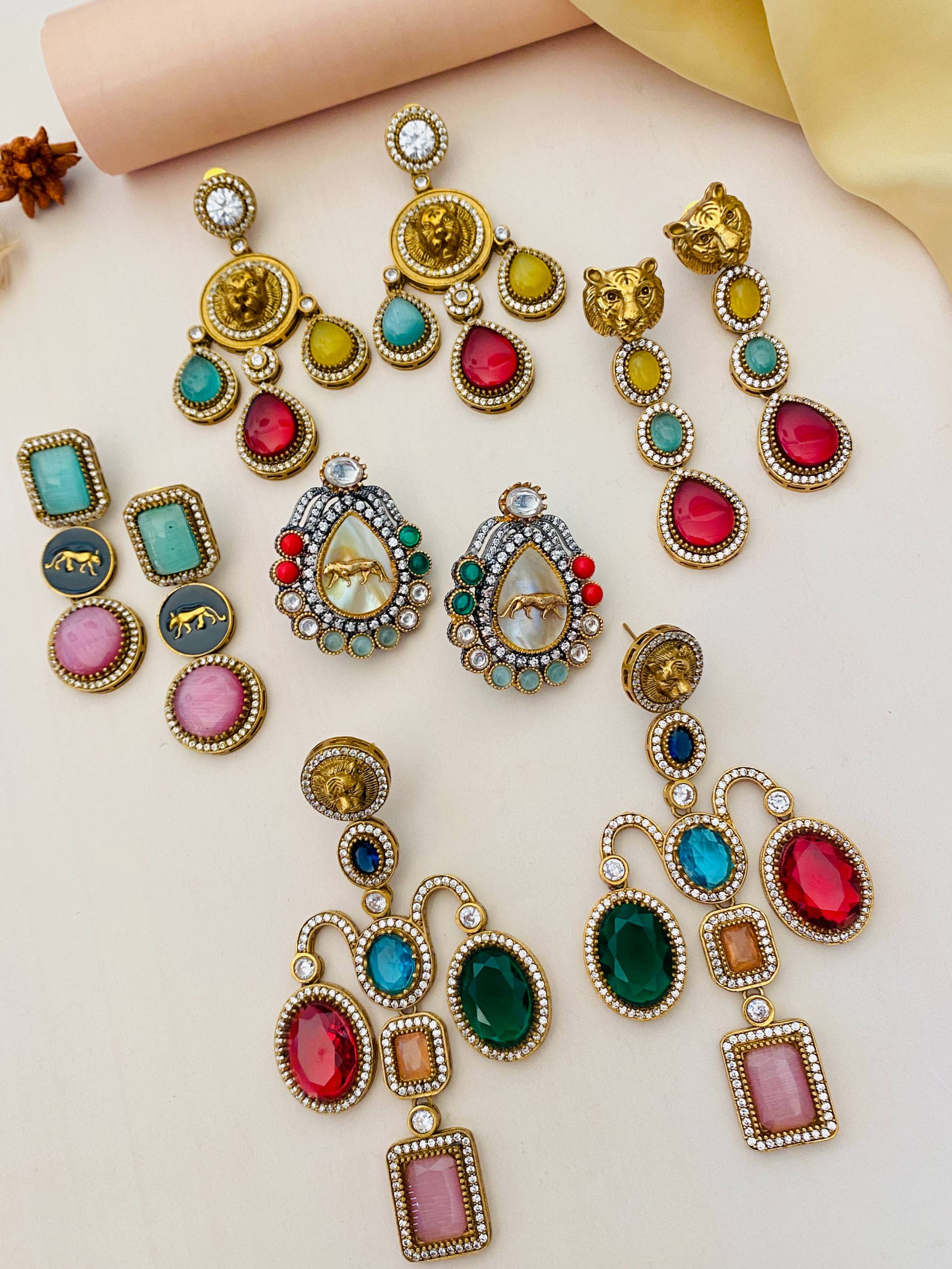 Colorful and elegant earrings collection from Abdesignsjewellery featuring gold accents and gemstones