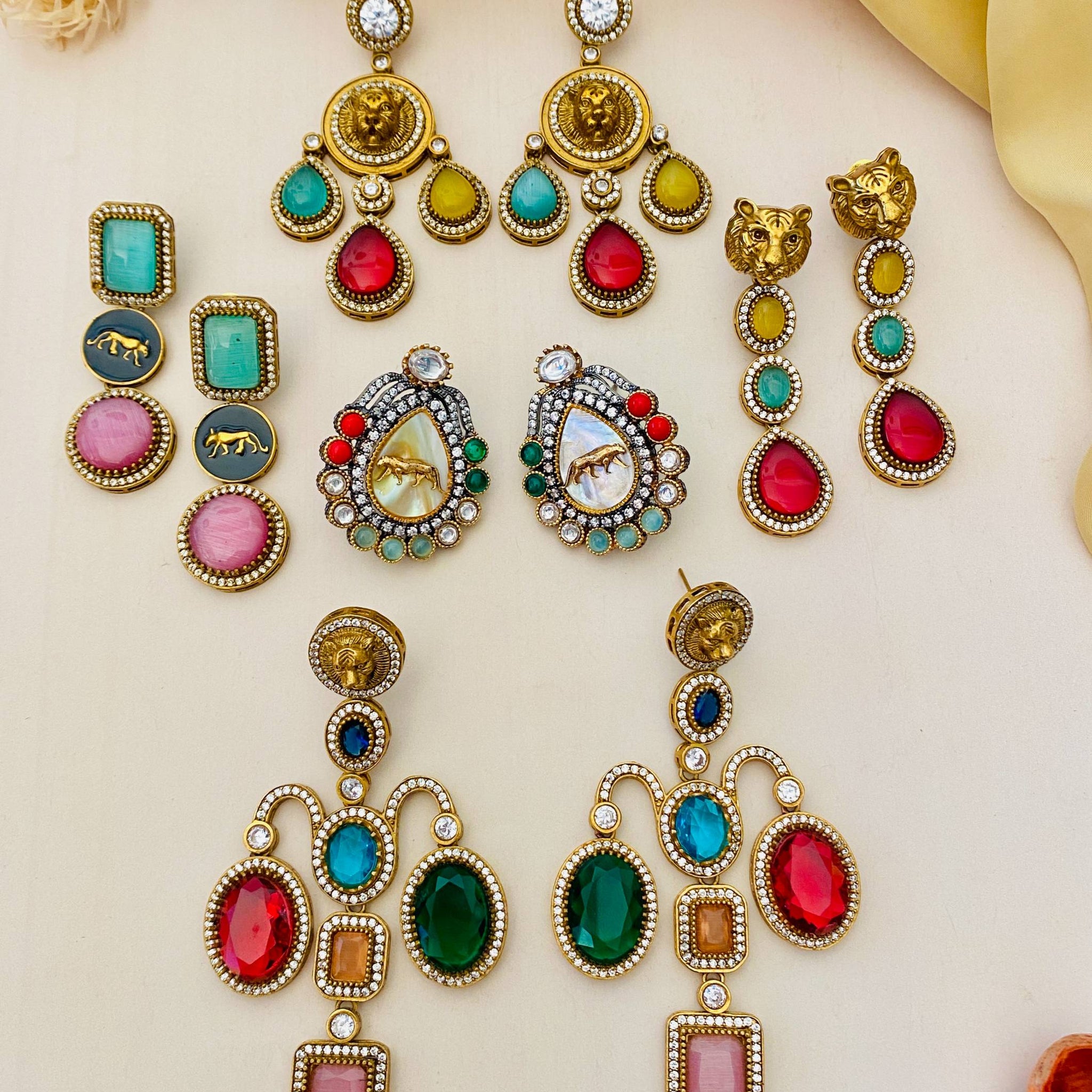 Assorted traditional earrings by Abdesignsjewellery featuring colorful gemstones and intricate designs