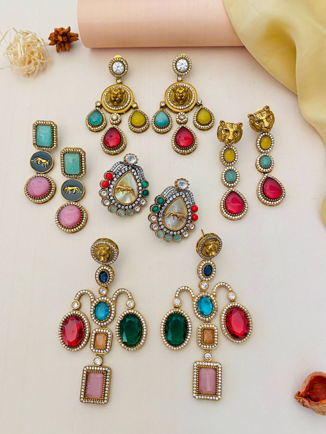 Colorful statement earrings collection by Abdesignsjewellery featuring intricate designs and vibrant stones