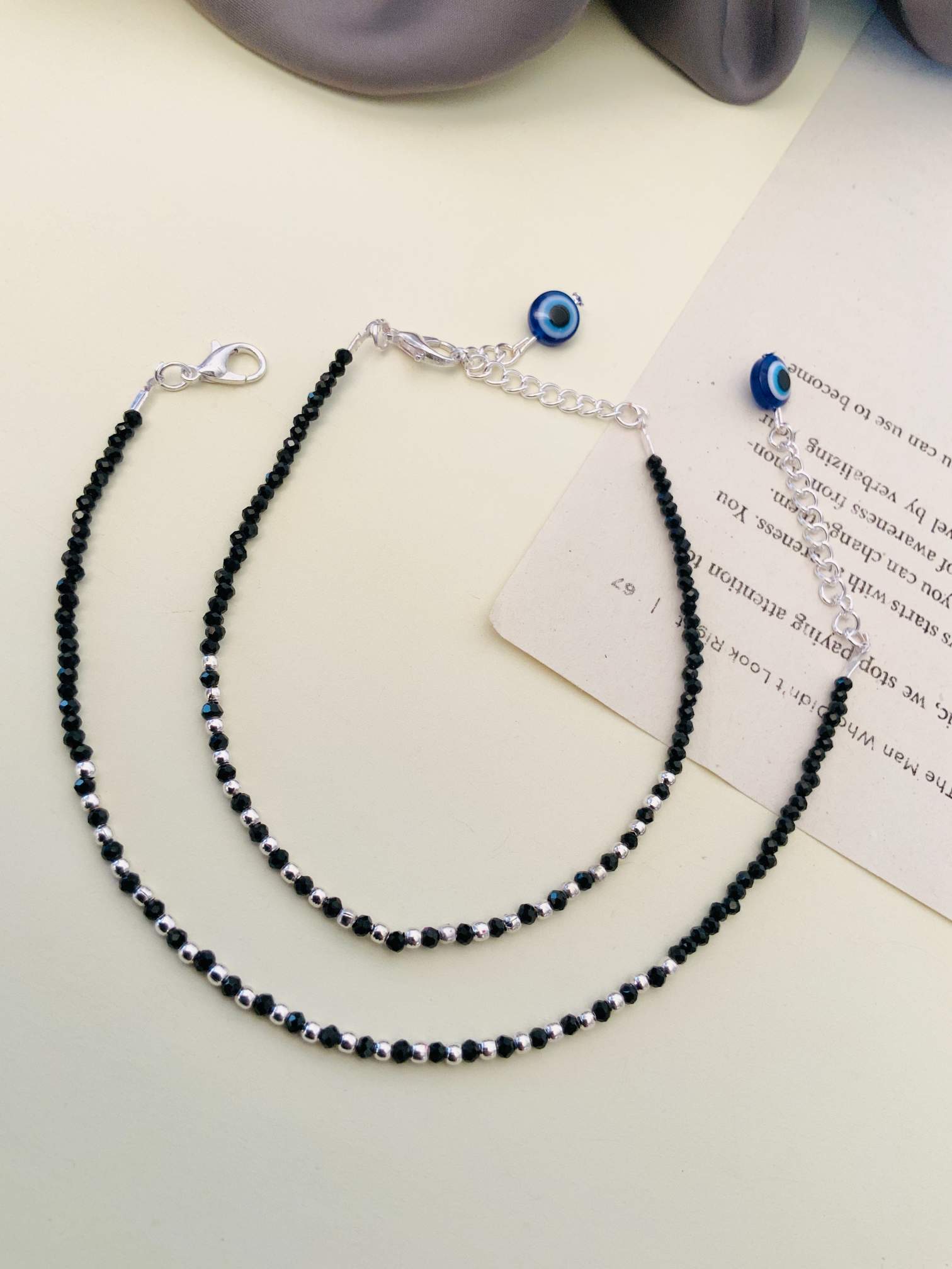Eye Catching Silver Plated Evil Eye Anklet combo with black beads and blue evil eye charm from Abdesignsjewellery