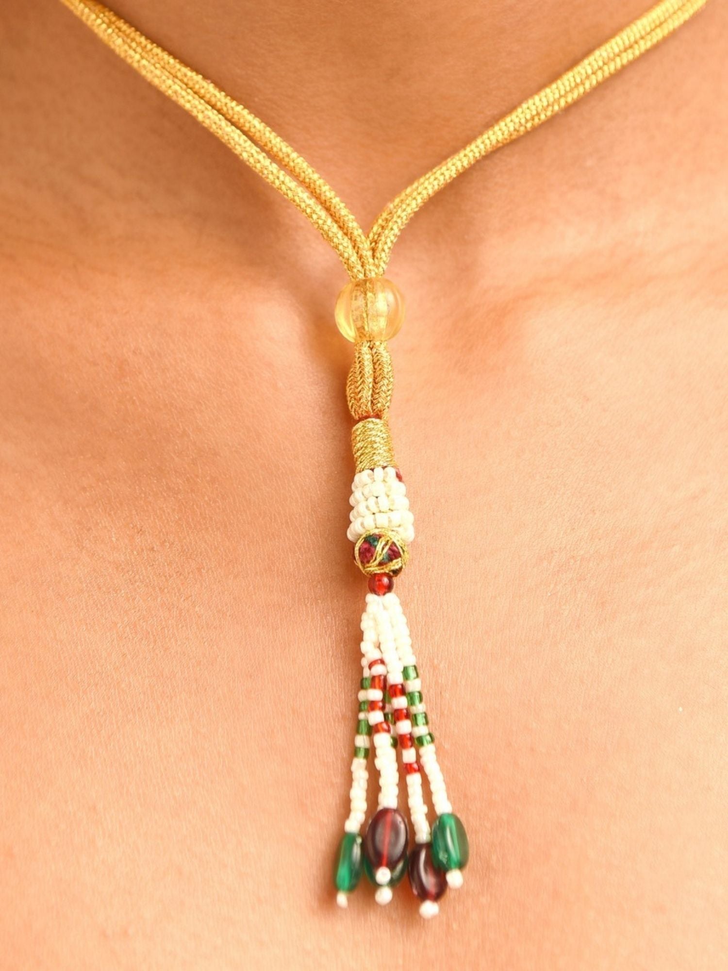 Abdesignsjewellery gold cord necklace with tassel beads and fashion jewelry with green gem centerpiece