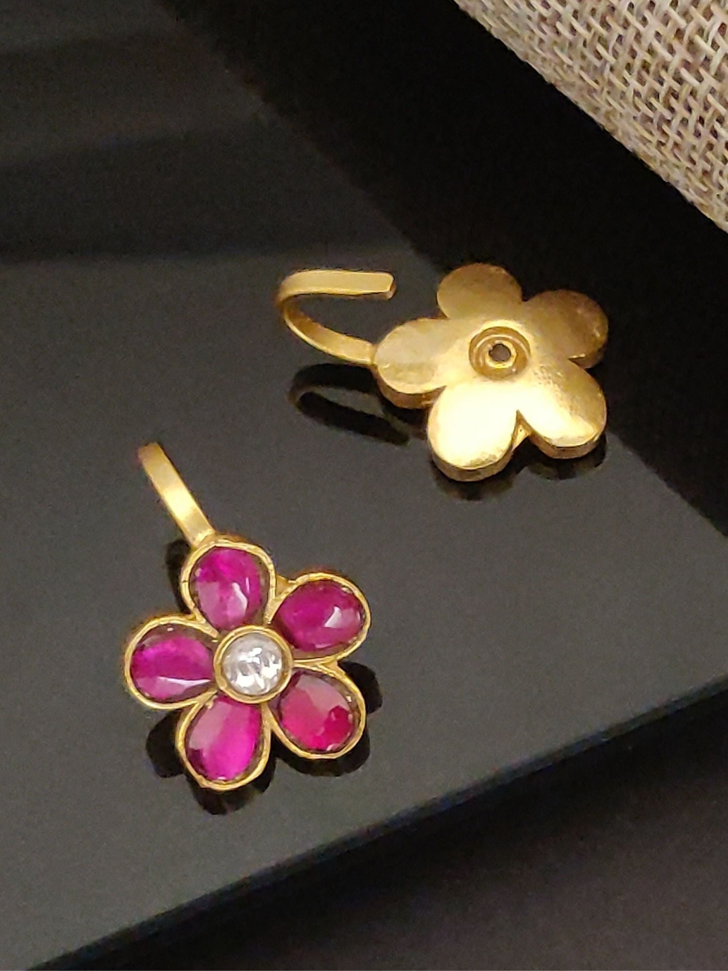 Festive artificial bugdi earring gold floral nose pin with pink enamel petals and clear stone