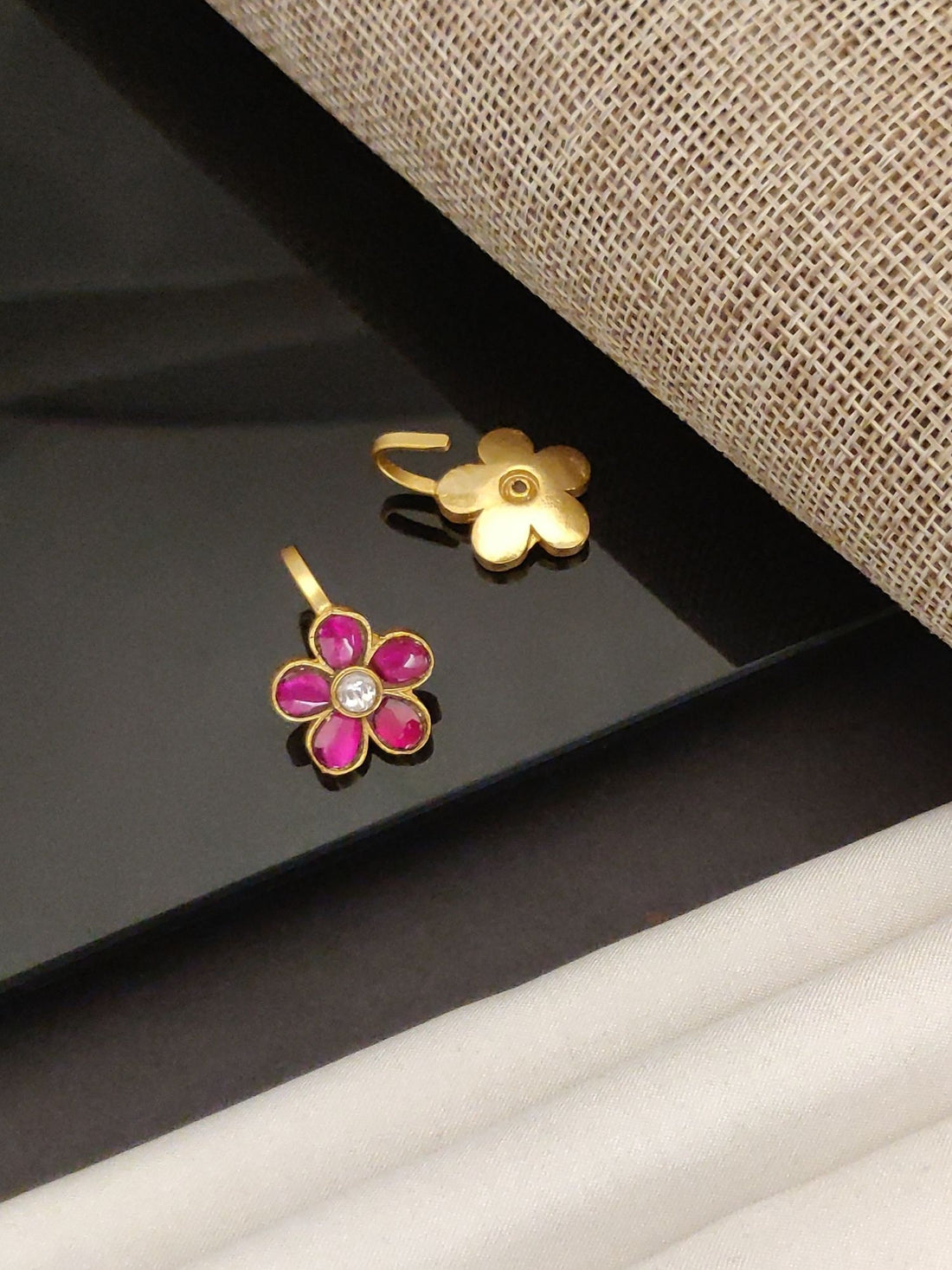 Festive artificial bugdi earring pair gold floral design with pink enamel petals and central crystal