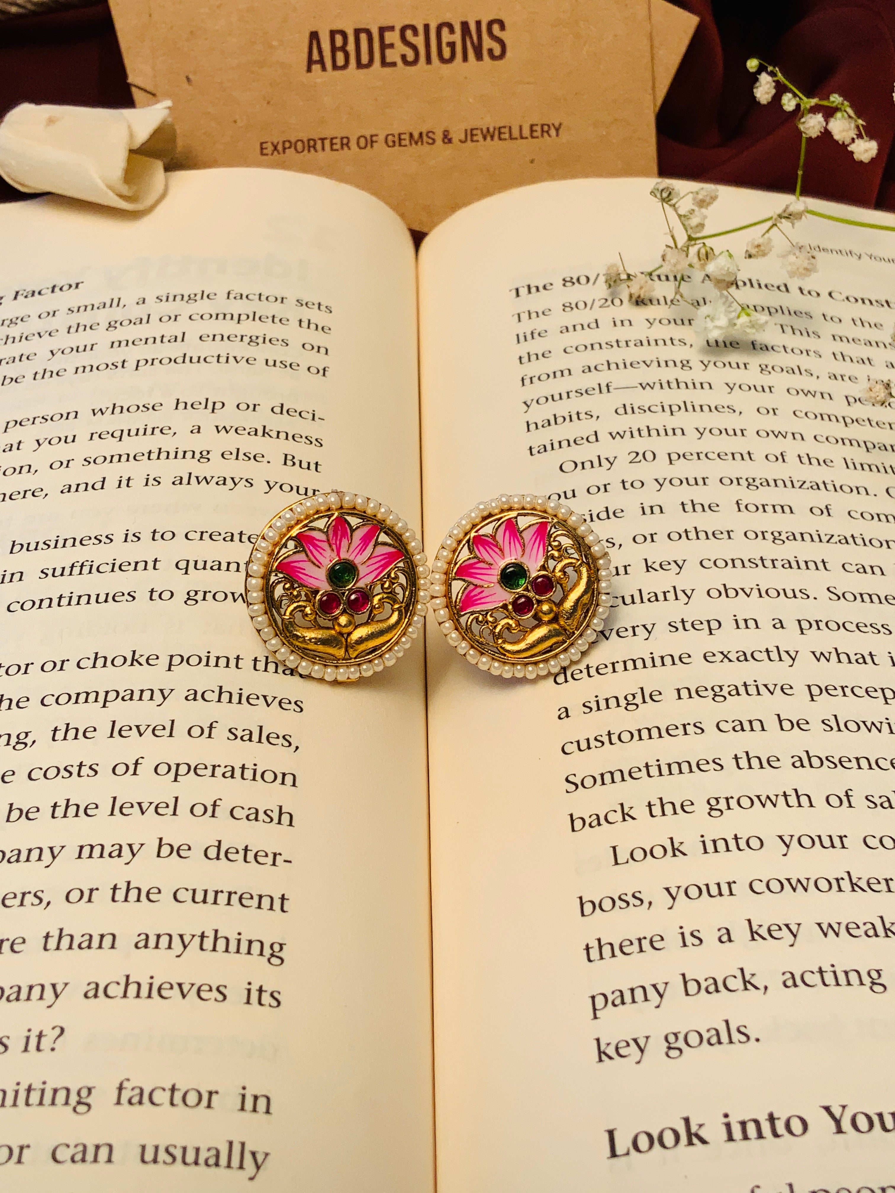 Floral Antique Gold Plated Necklace Set with pink flower design by Abdesignsjewellery on an open book