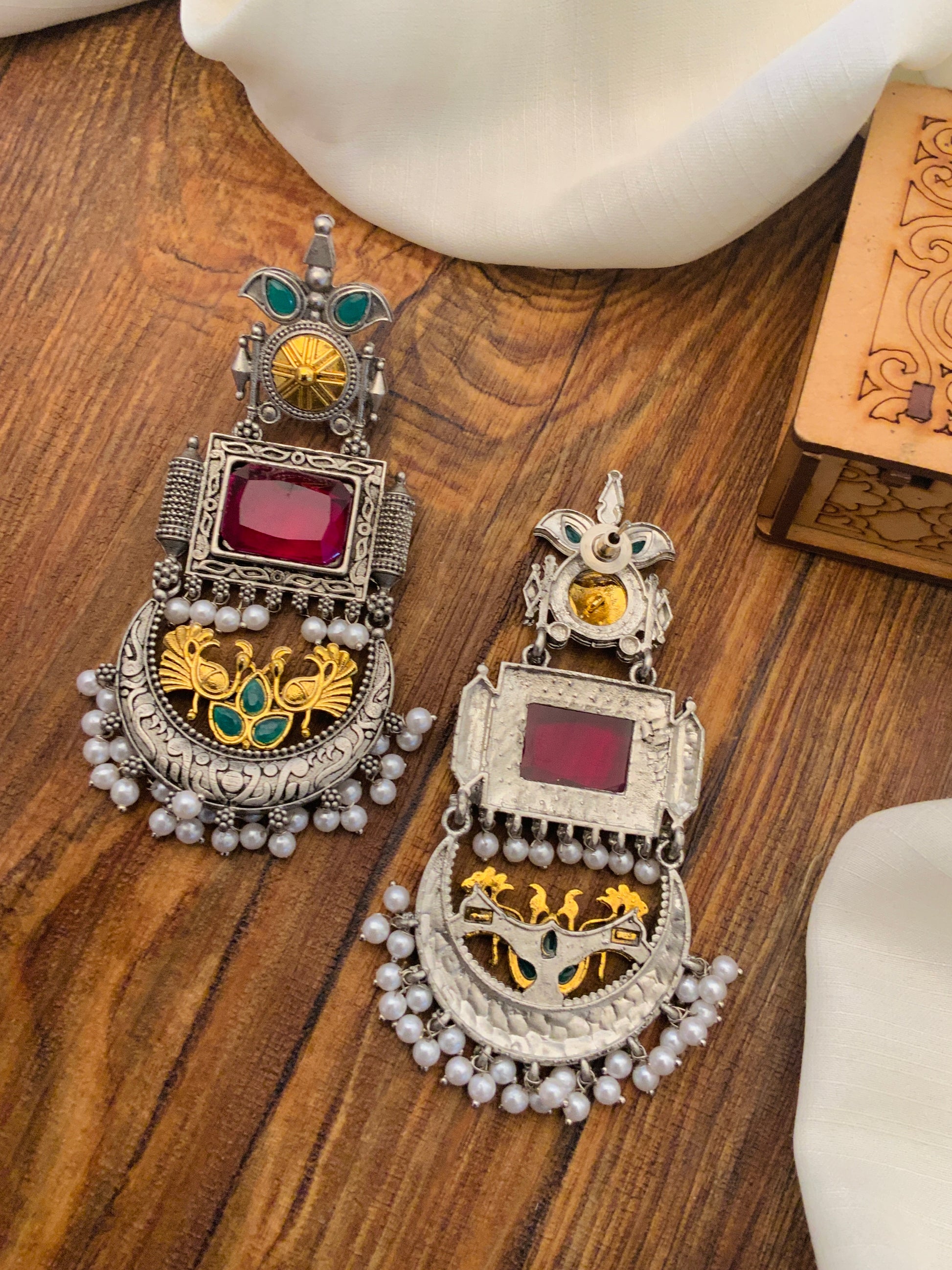 Abdesignsjewellery German Silver Dual Tone Peacock Earrings with intricate design and pearl embellishments