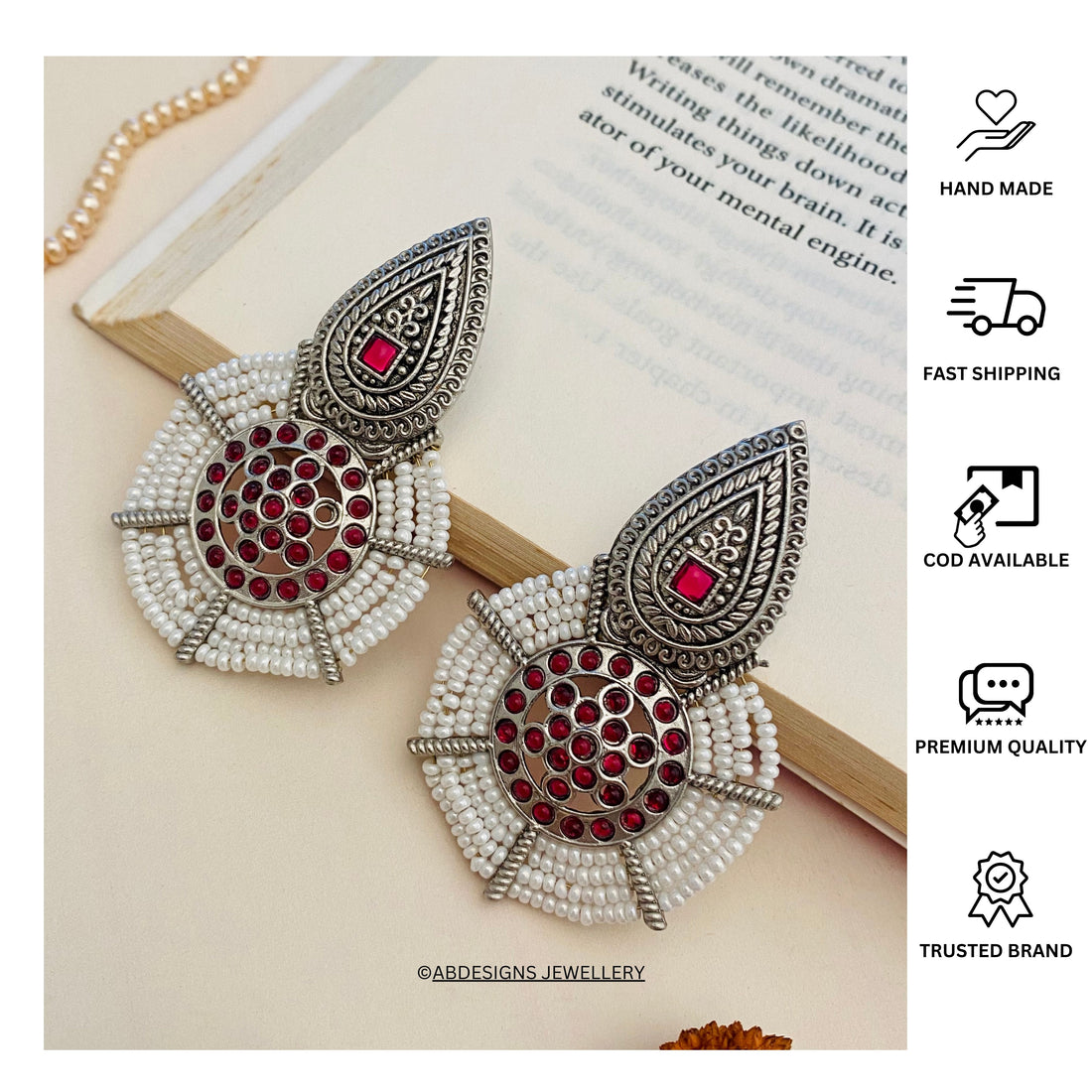 Abdesignsjewellery German Silver Pearl Earring with intricate design and red gemstone accents worn by a woman