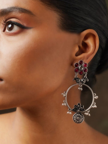 Abdesignsjewellery German Silver Plated Floral Earring with red accents worn on model's ear