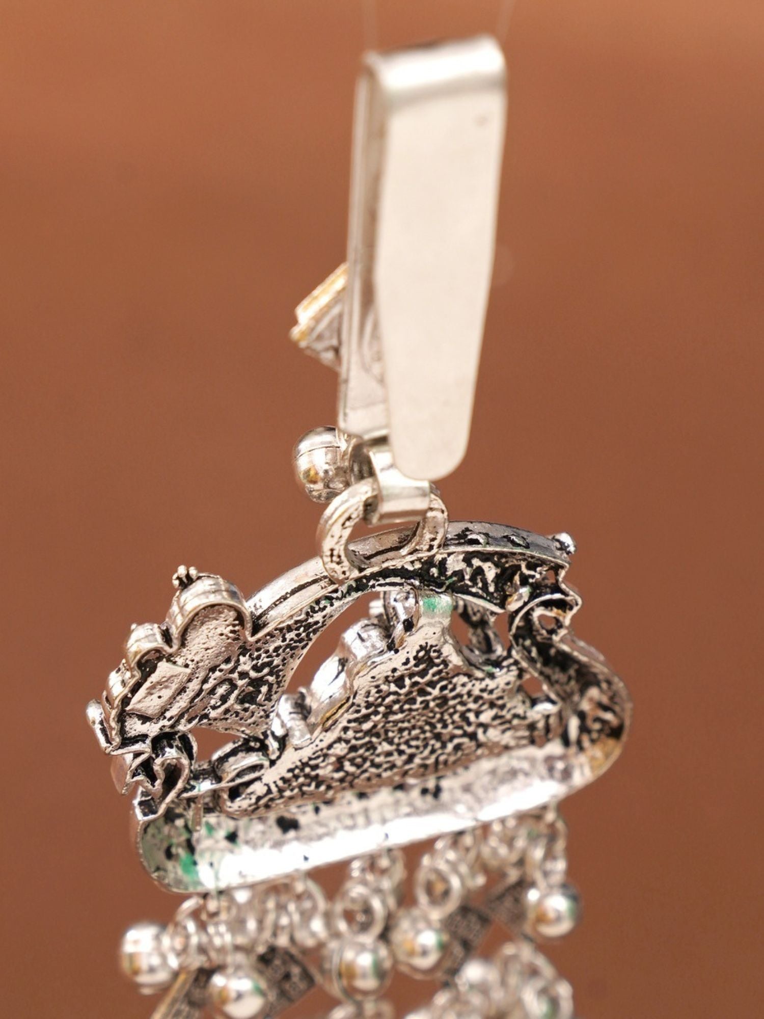 German silver saree juda pin combo close up showing textured silver clip with dangling beads and detailed filigree