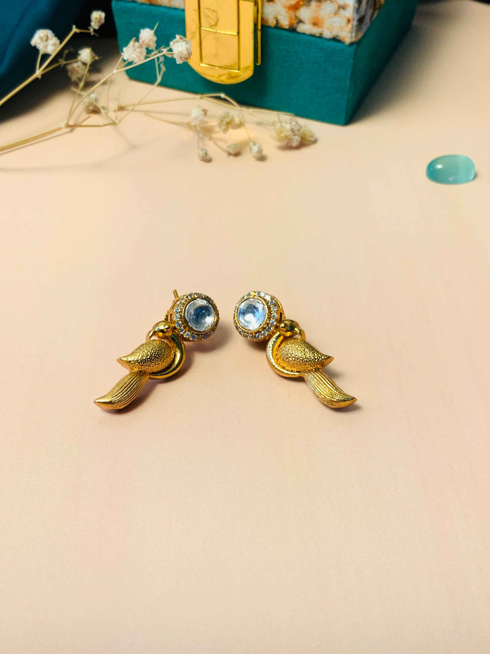 Glass Kundan Polki Parrot Studs Earrings with gold-tone intricate parrot design and clear stone accents