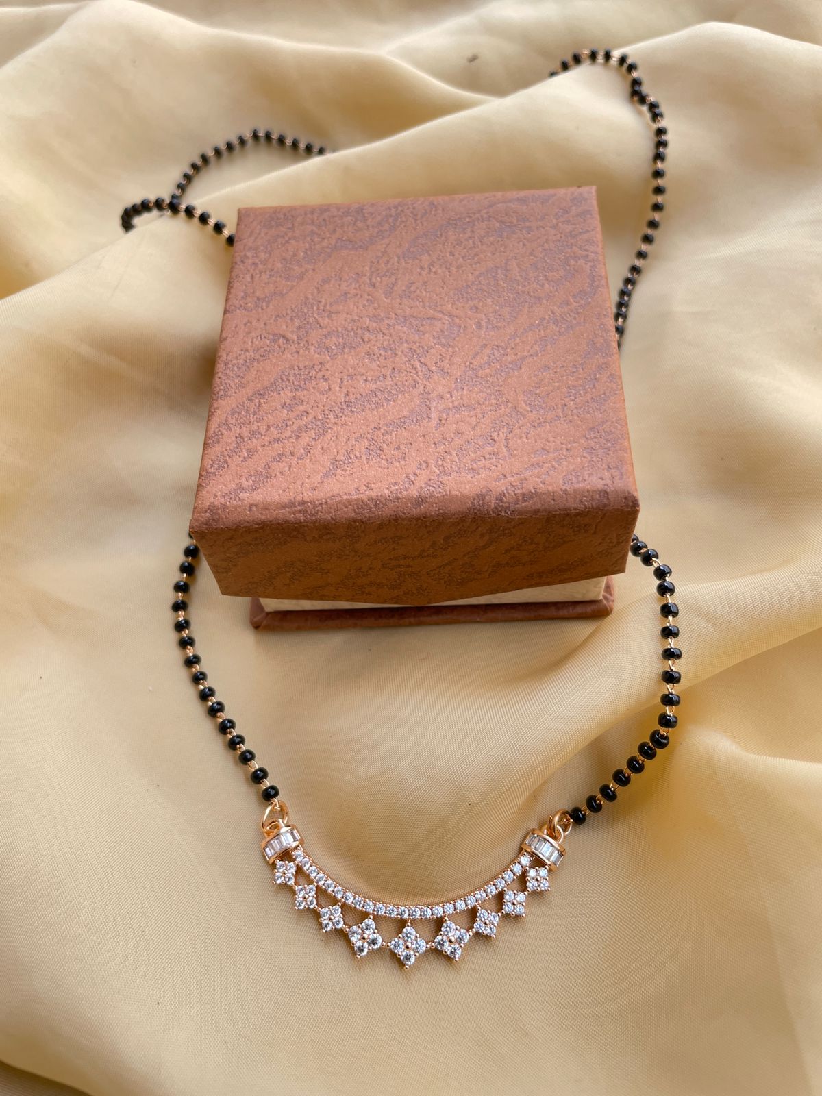Gold Plated American Diamond Mangalsutra with black beads and intricate pendant by Abdesignsjewellery