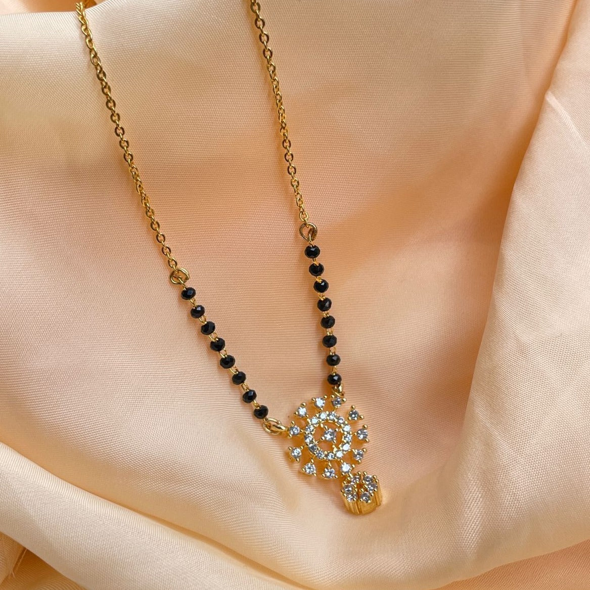 Gold Plated American Diamond Mangalsutra by Abdesignsjewellery with black beads and intricate pendant