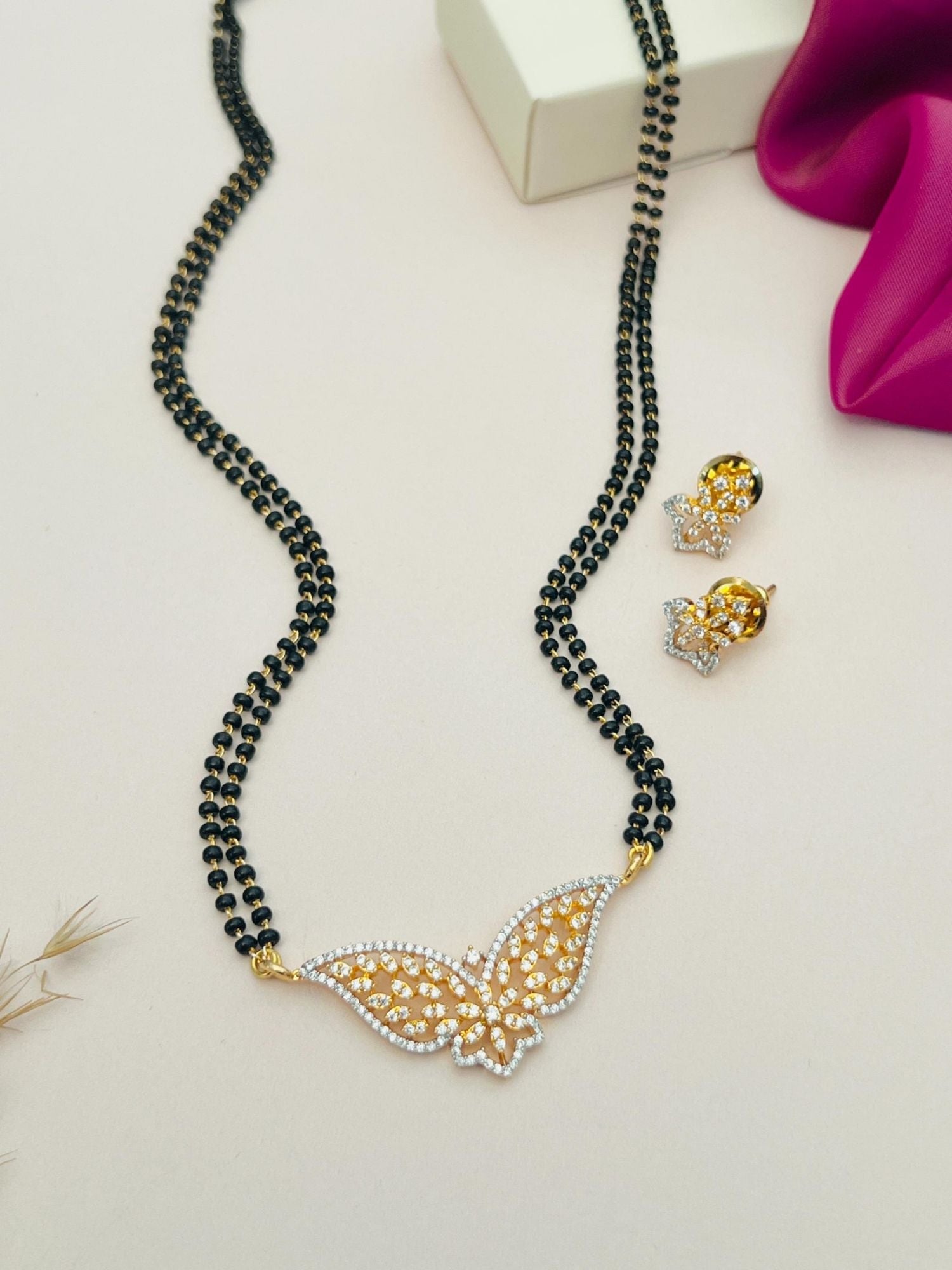 Abdesignsjewellery gold plated American diamond mangalsutra set with butterfly pendant and matching earrings