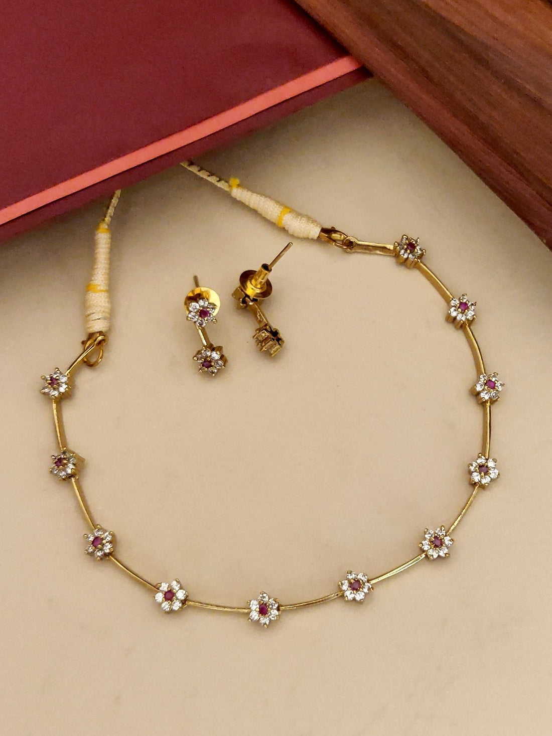 Abdesignsjewellery gold plated floral necklace set with dainty flower charms and matching stud earrings