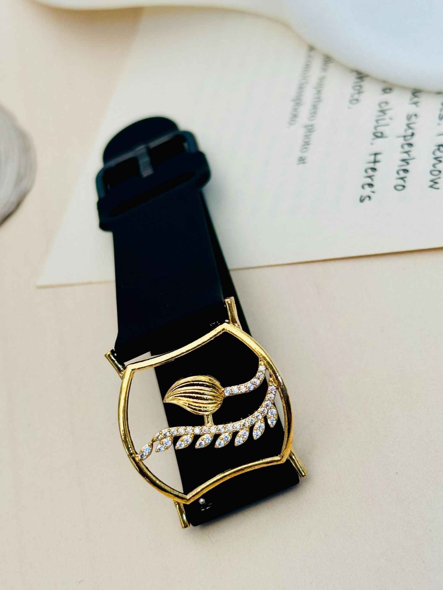 Abdesignsjewellery gold plated hand belt bracelet with black leather strap and leaf crystal accents for evening wear