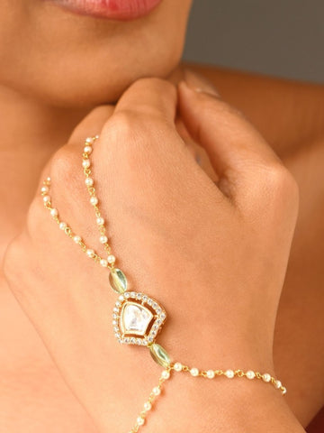 Abdesignsjewellery gold plated hand pocha bracelet on female hand with central crystal charm and beaded chain